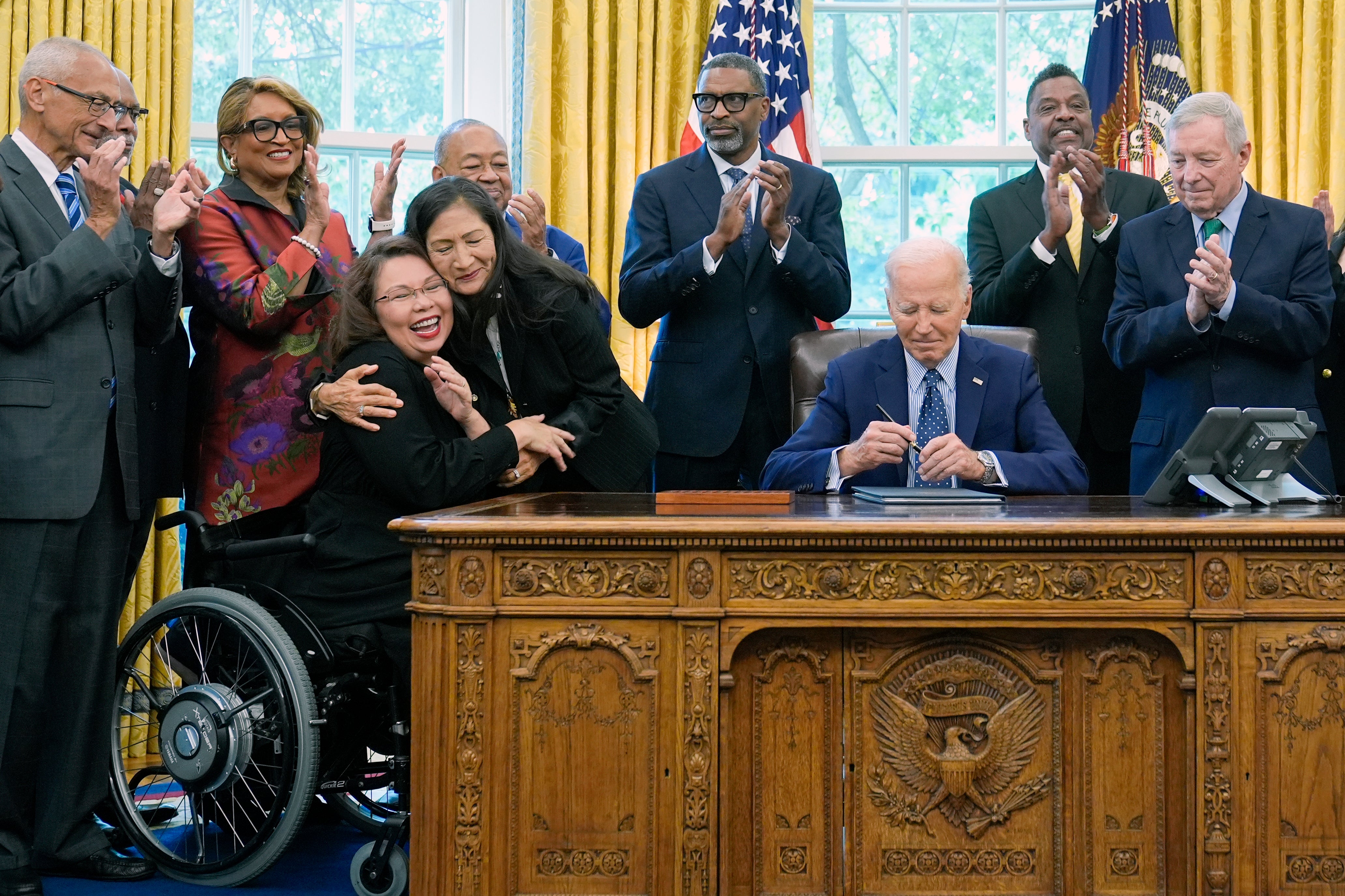 Duckworth at the Oval Office after Joe Biden signed a proclamation to designate the Springfield 1908 Race Riot National Monument