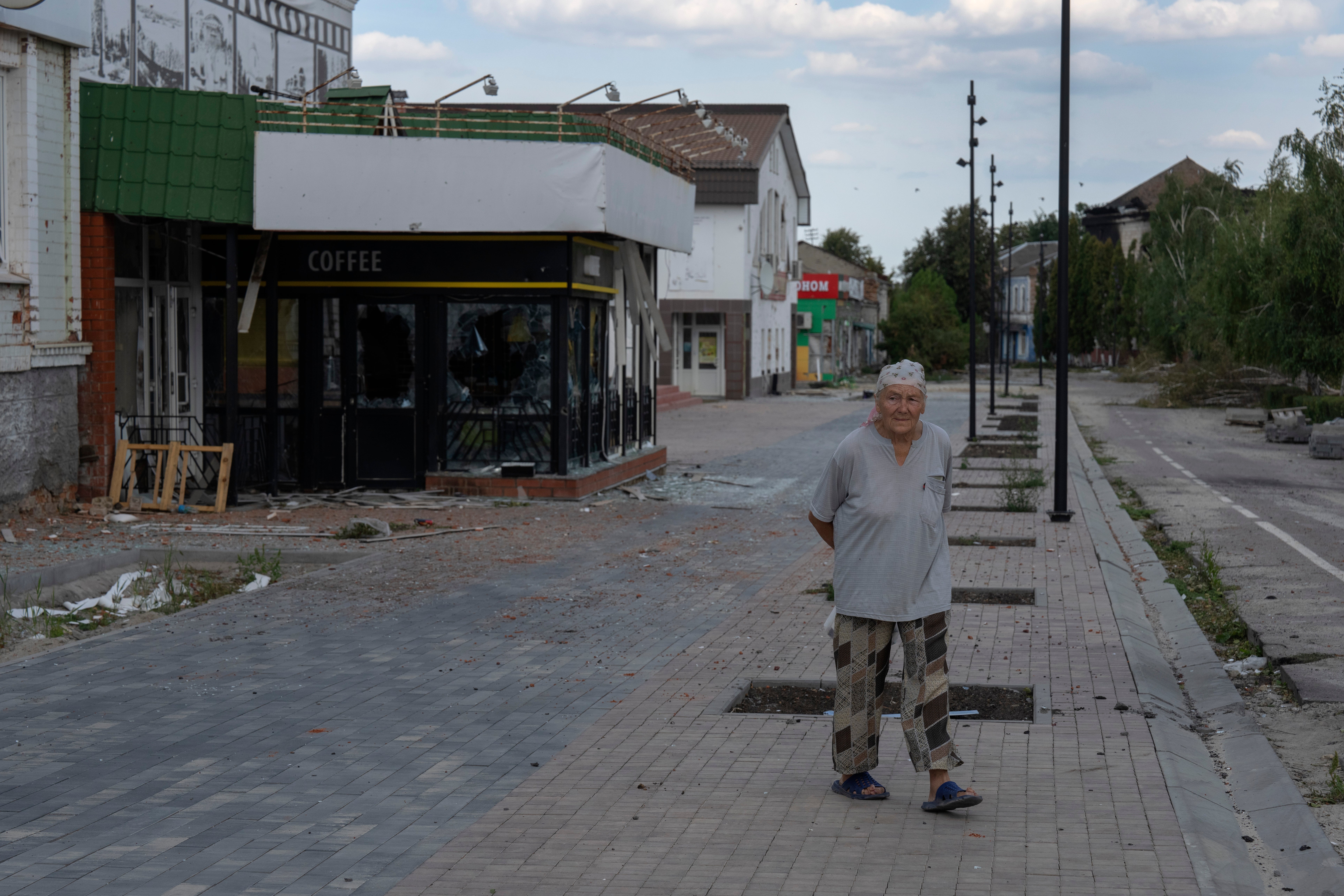 A local resident walks past at a city centre in Sudzha, Kursk region, Russia, Friday, Aug. 16, 2024.