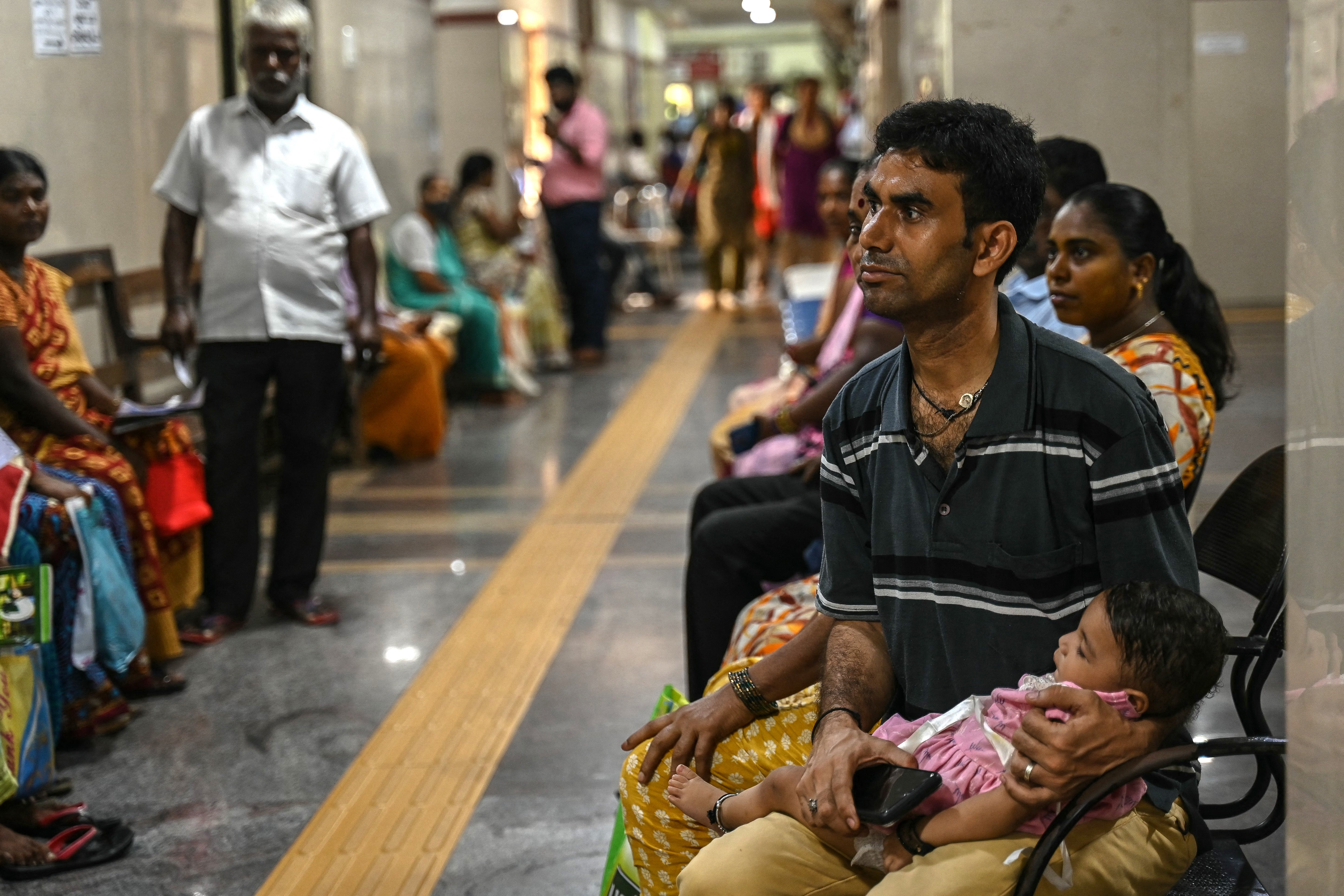 People wait for their turn at a government hospital