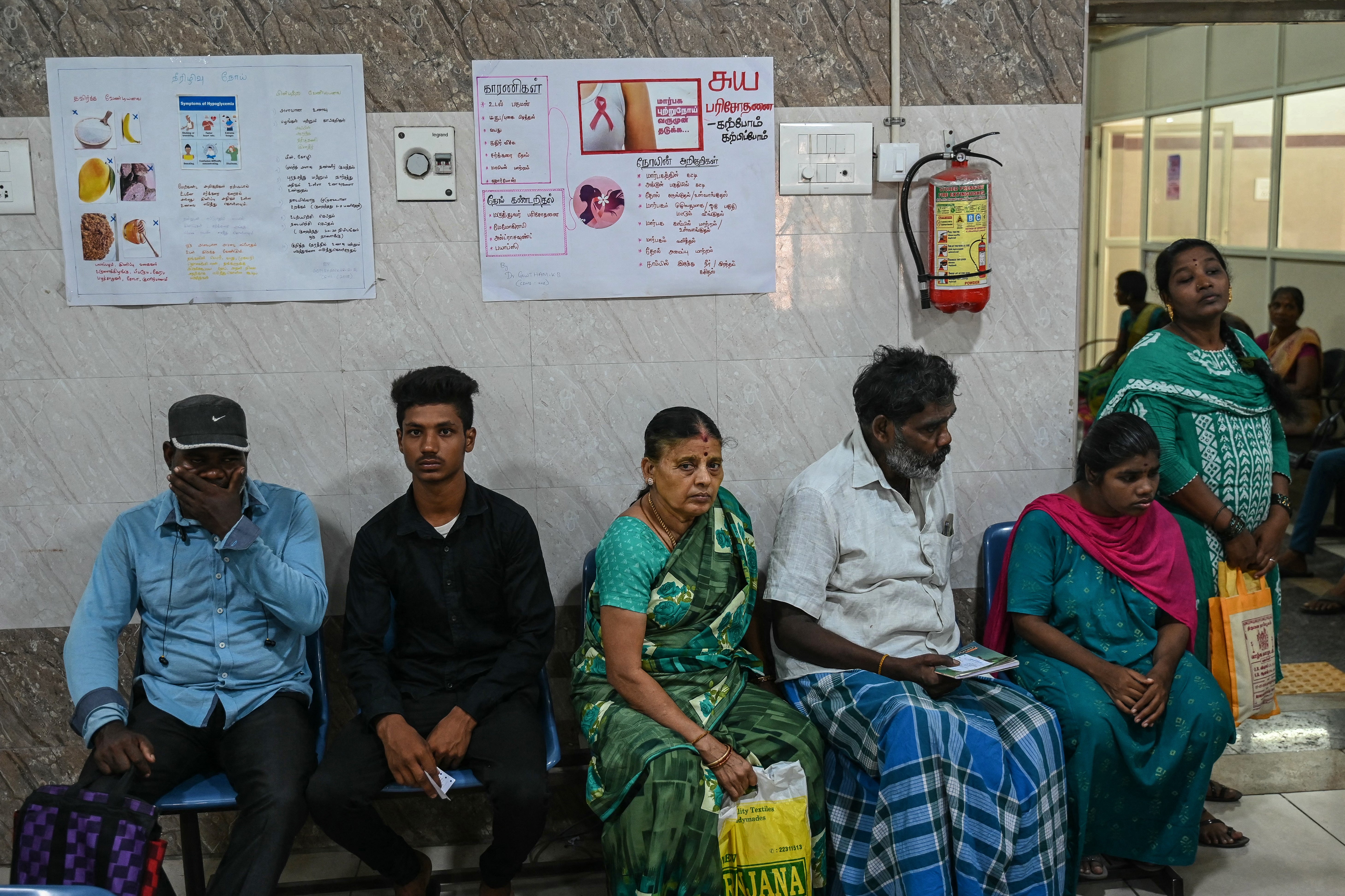 People wait for their turn at a government hospital during a nationwide strike by doctors