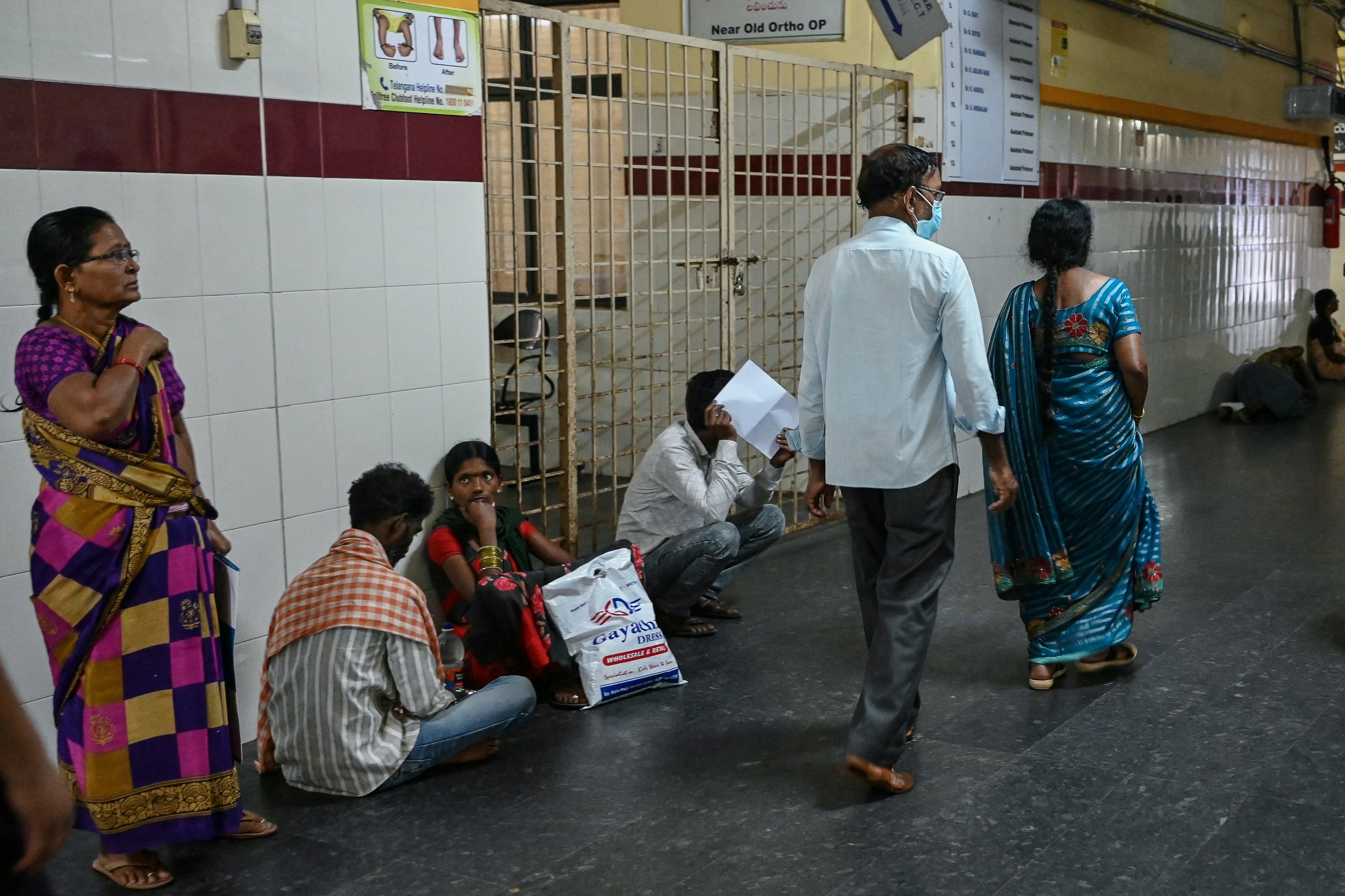 People wait for their turn at a government hospital in Hyderabad on August 17, 2024, during a nationwide strike by doctors against the rape and murder of their colleagues in the Indian state of West Bengal.