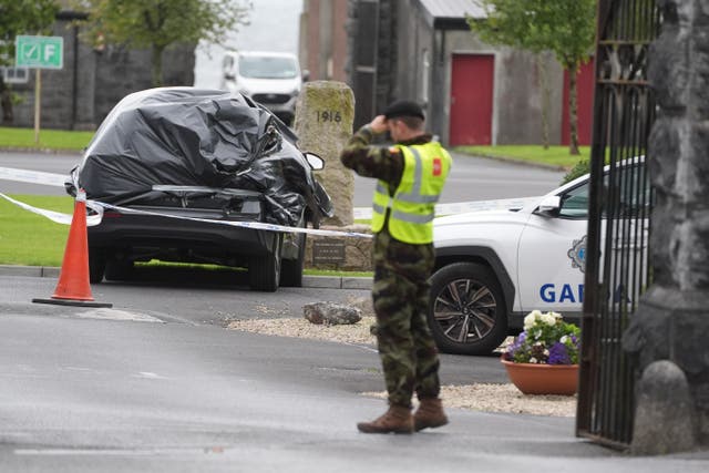 A car wrapped in plastic at the scene at Renmore Barracks in County Galway (Brian Lawless/PA)