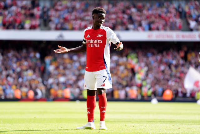 <p>Bukayo Saka celebrates his goal against Wolves</p>