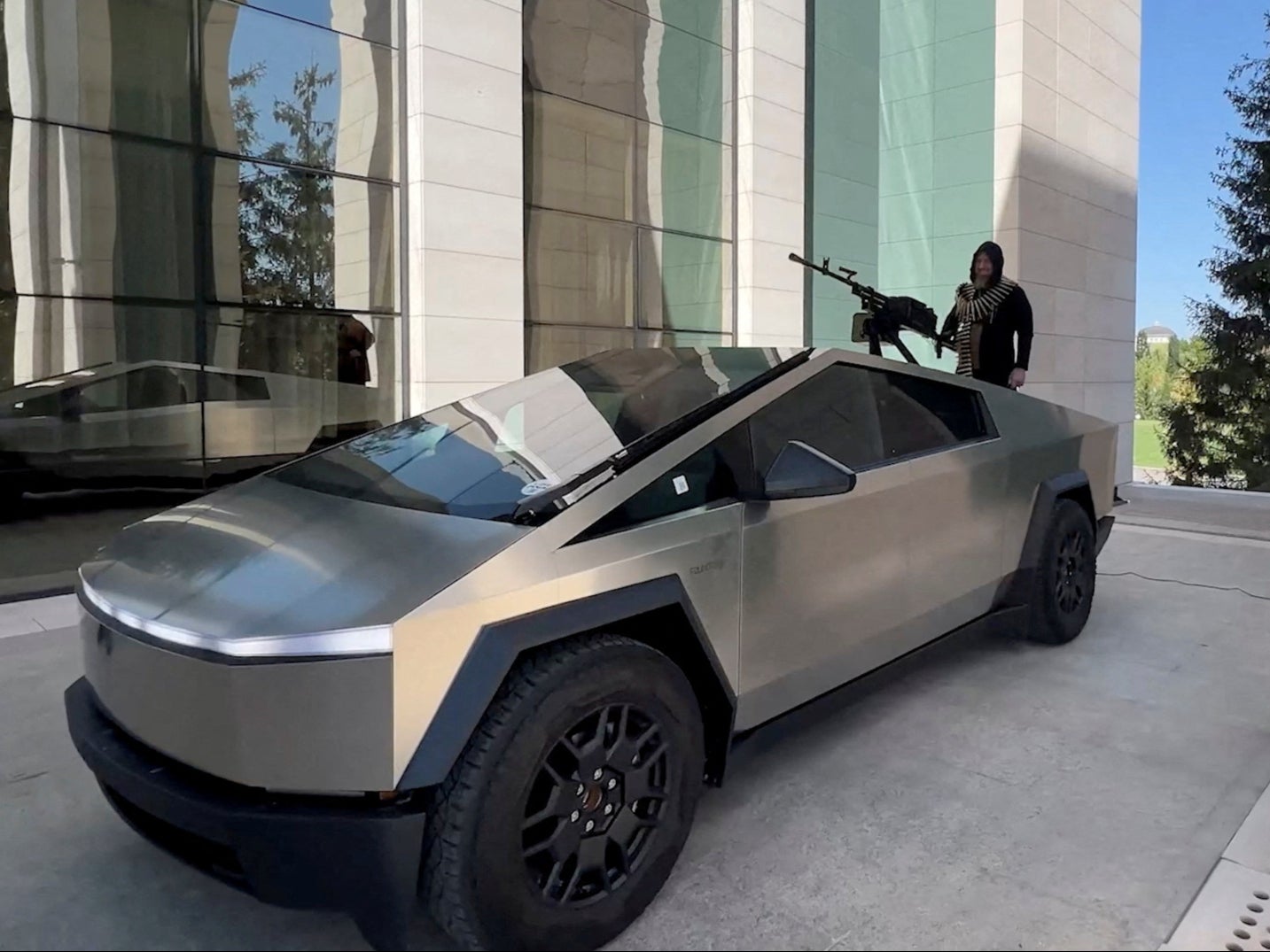 Leader of Russia’s Chechnya region Ramzan Kadyrov is seen atop what is said to be a Tesla Cybertruck equipped with a machine gun, in Grozny, Russia, in this still image from video published August 17, 2024