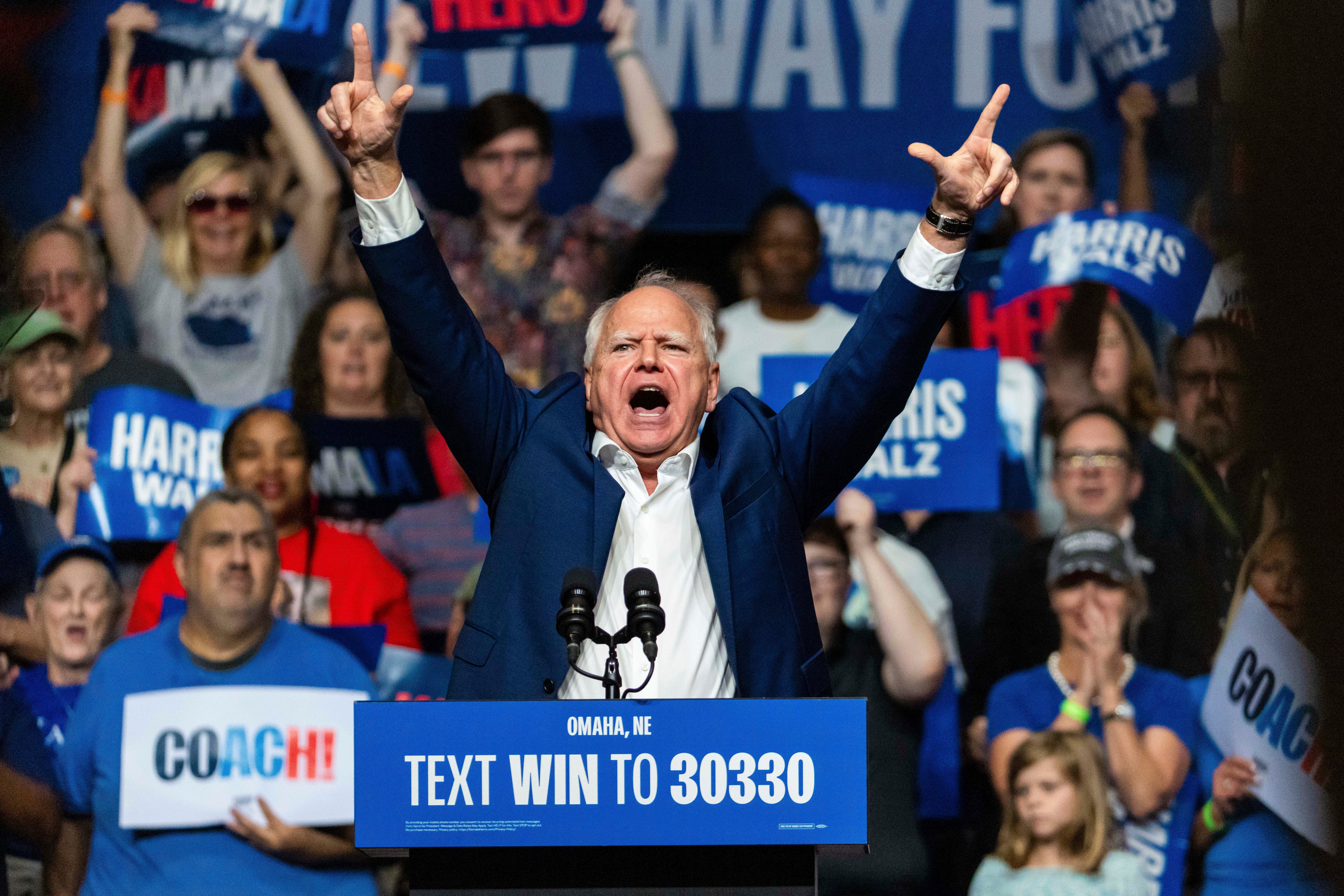 Governor Tim Walz energizes a crowd of supporter in Nebraska on Saturday