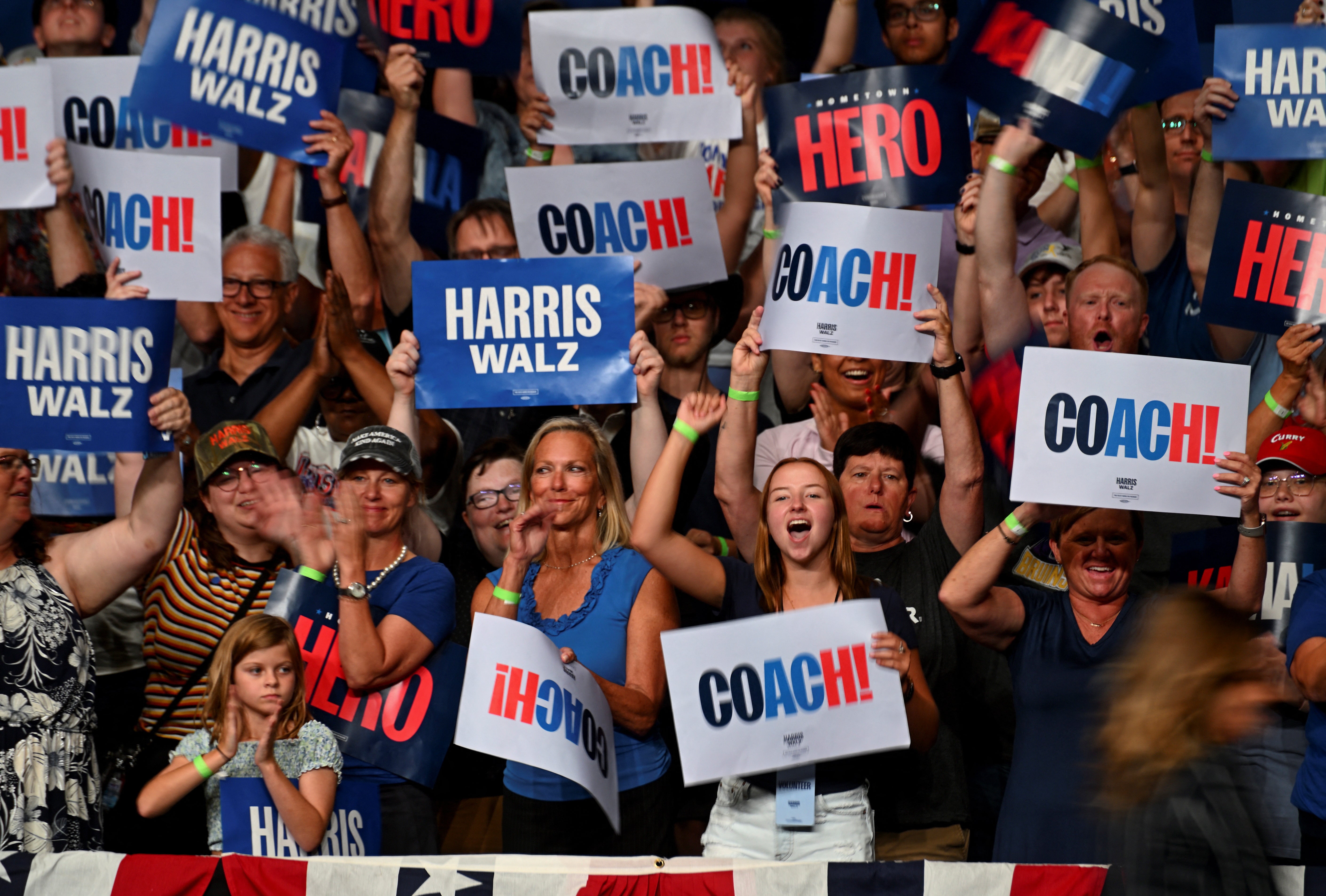 Reactions of supporters during a rally for Walz during a visit to his home state