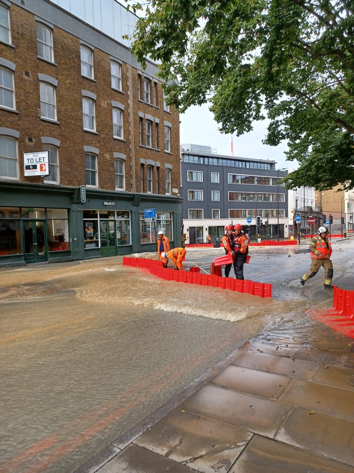 Dozens of firefighters battle flooding in Kings Cross as hotel evacuated