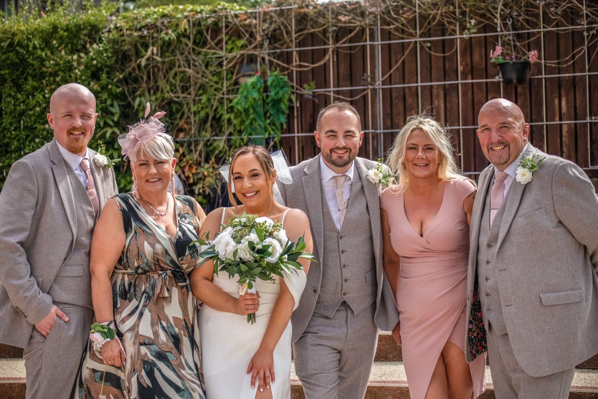 A picture of Nadia and Nathan with family on their wedding day, taken by their friend Georgia Cooper