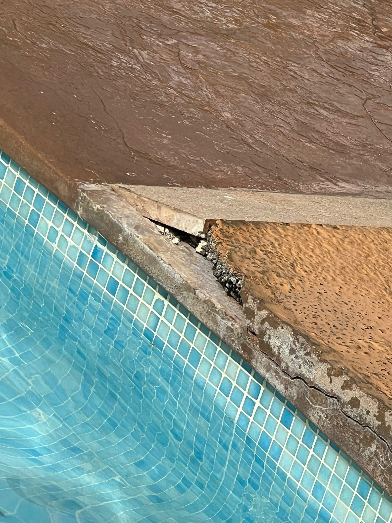 Broken concrete at the hotel pool