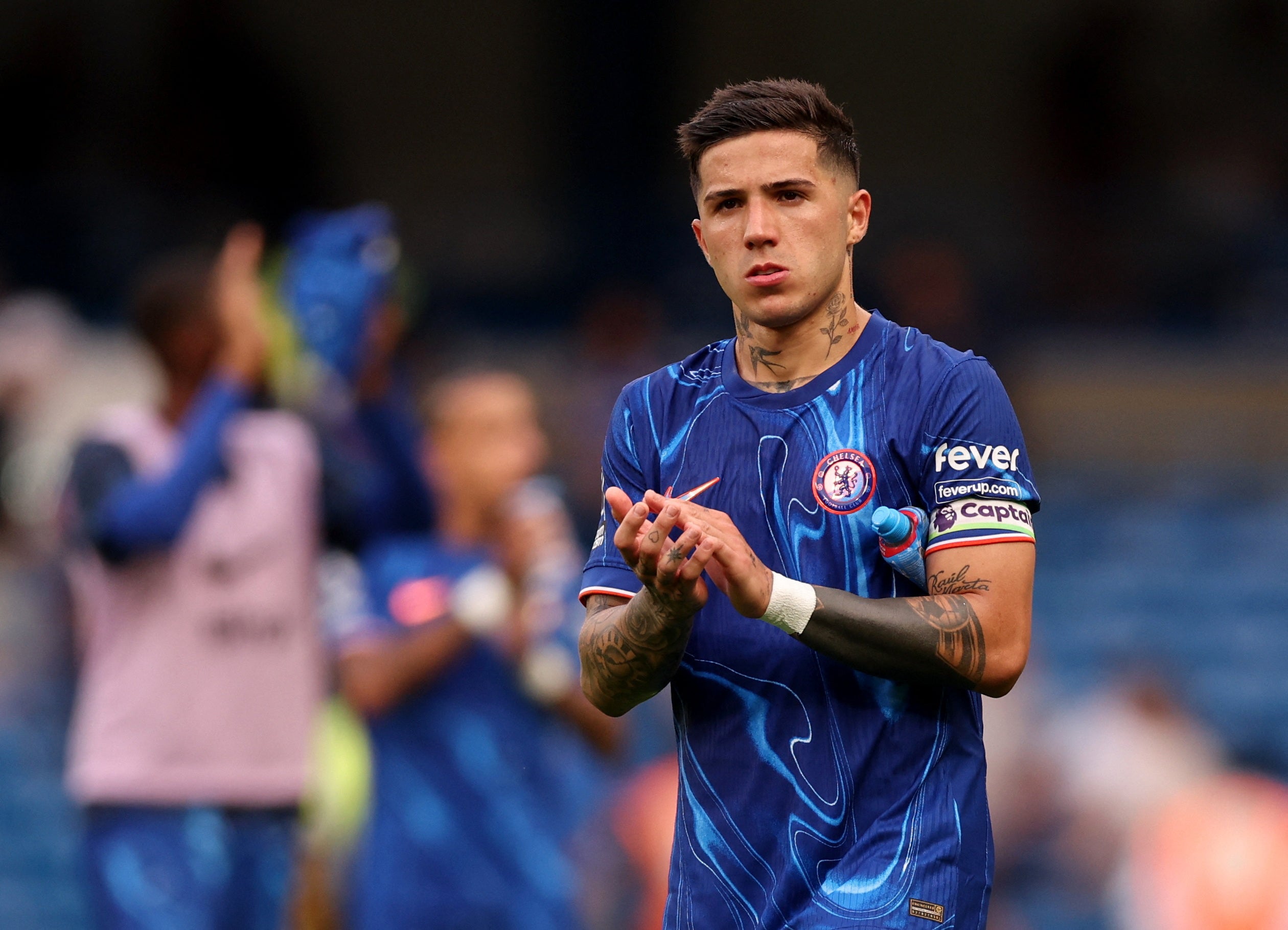 Enzo Fernandez applauds the Chelsea fans.