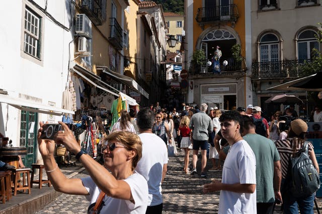 <p>Tourists visit the old center of Sintra, Portugal</p>