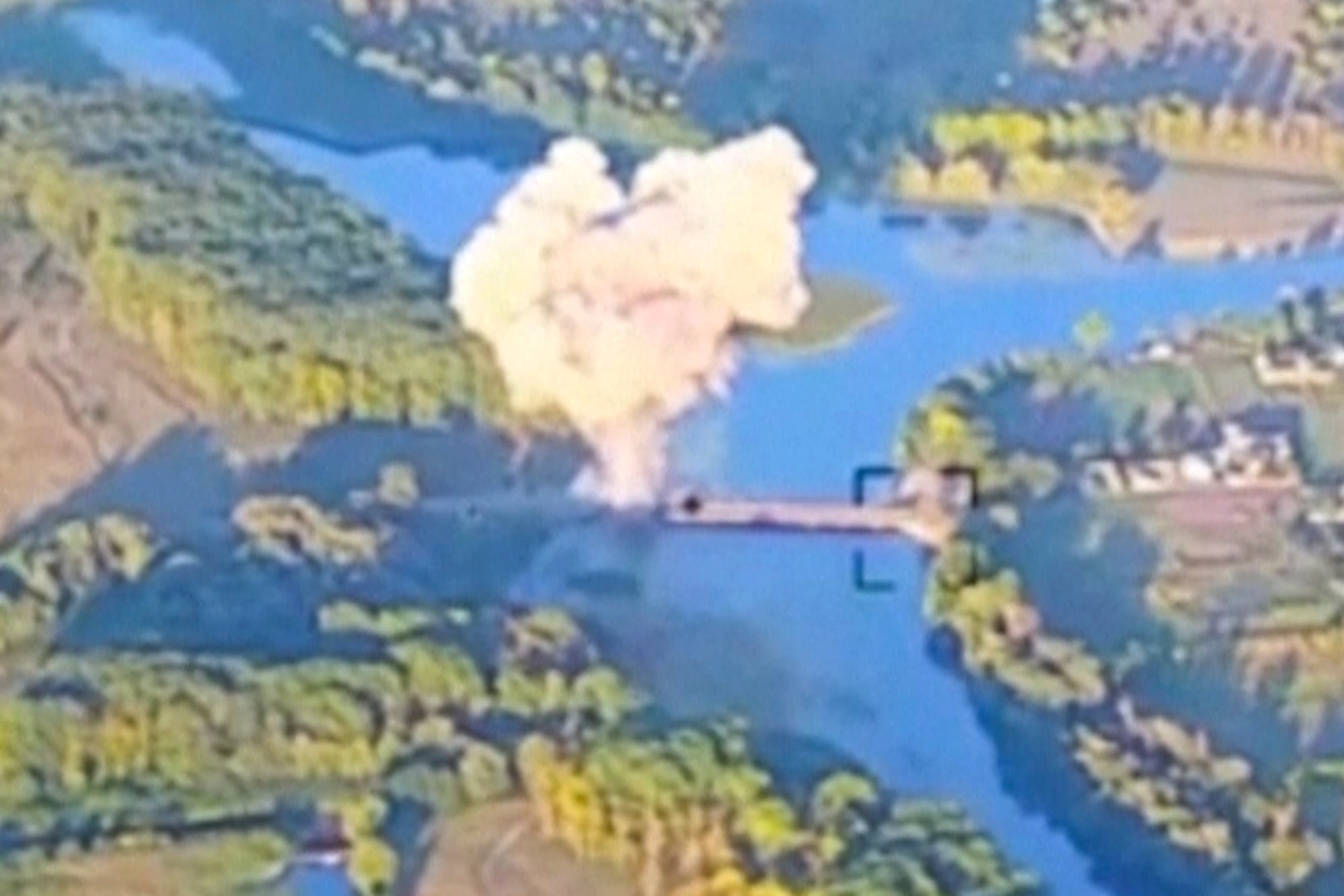 Smoke billows in . what is said to show the destruction of a key bridge in Russia's Kursk region