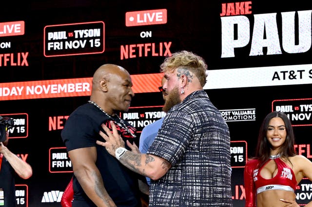 <p>Jake Paul (right) shoving Mike Tyson in retaliation</p>