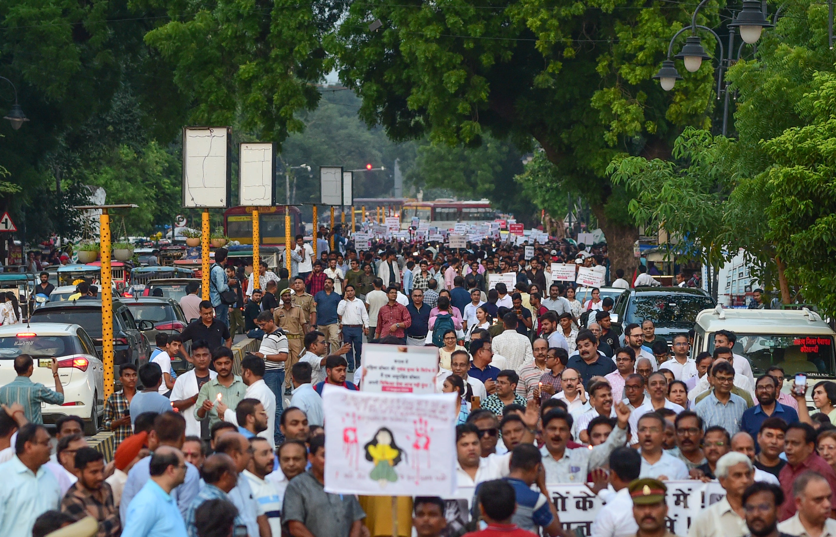 Healthcare workers take part in a protest against the rape and murder of a junior doctor in West Bengal