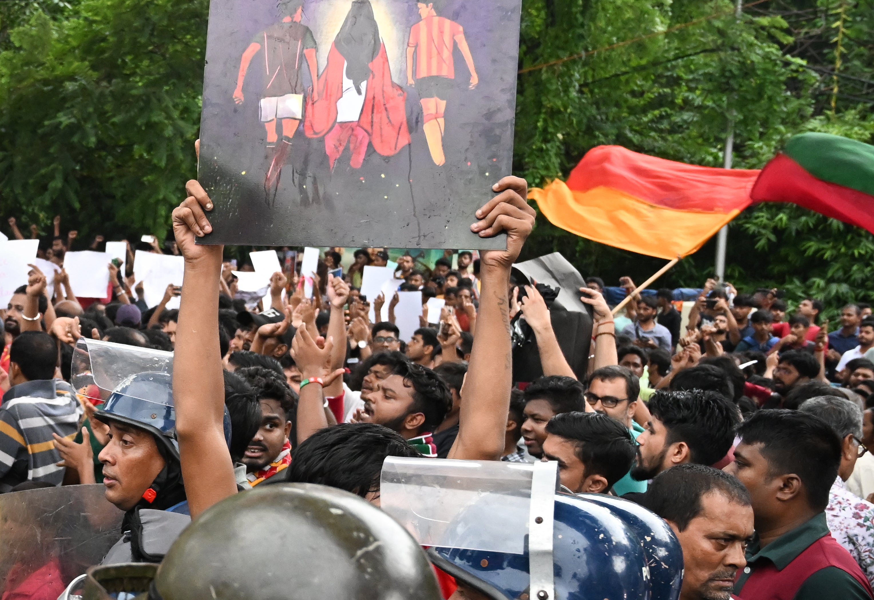 Supporters of rival football clubs East Bengal and Mohun Bagan shout slogans during a protest march in Kolkata