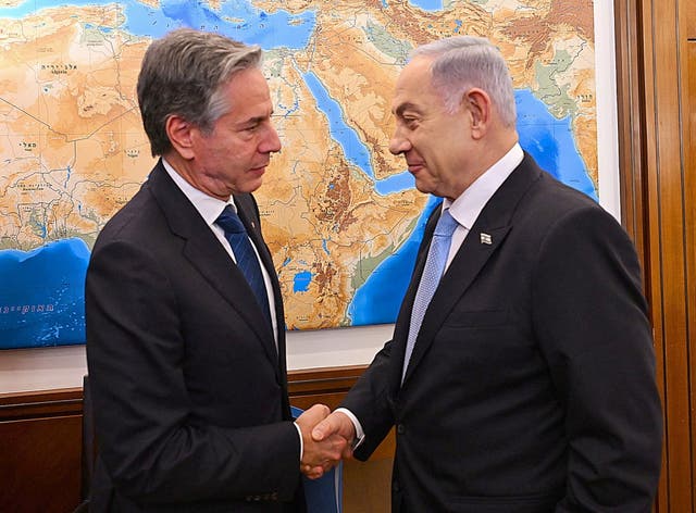 <p>Antony Blinken, left, greets Benjamin Netanyahu ahead of talks on Monday</p>