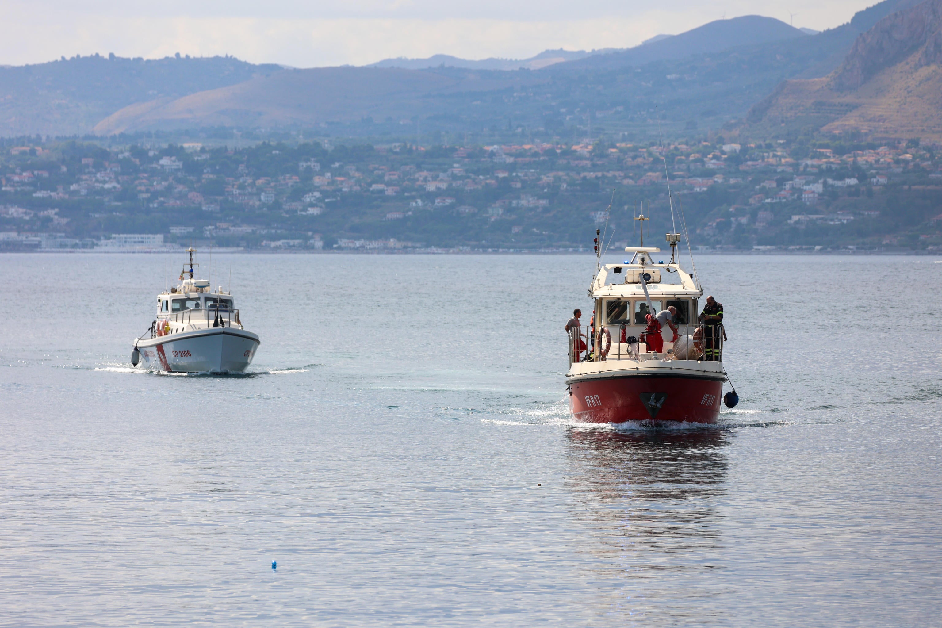 Boats are shown participating in the search effort with specialist divers.