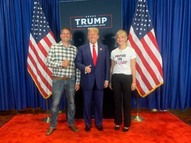 Jenna Pivovarczyk (R) sports her Swifties for Trump T-shirt during a Wisconsin rally in July