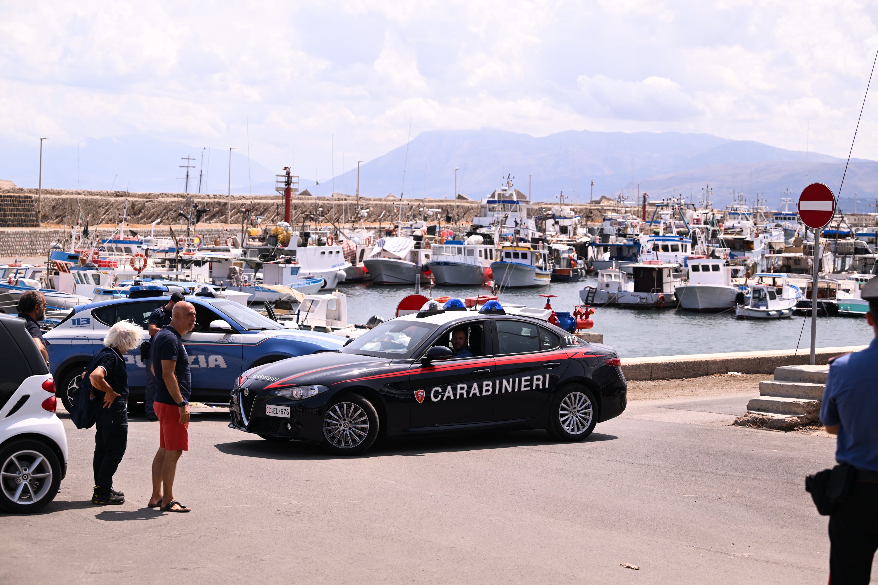 Police cars at the scene as the search continues for the missing tourists