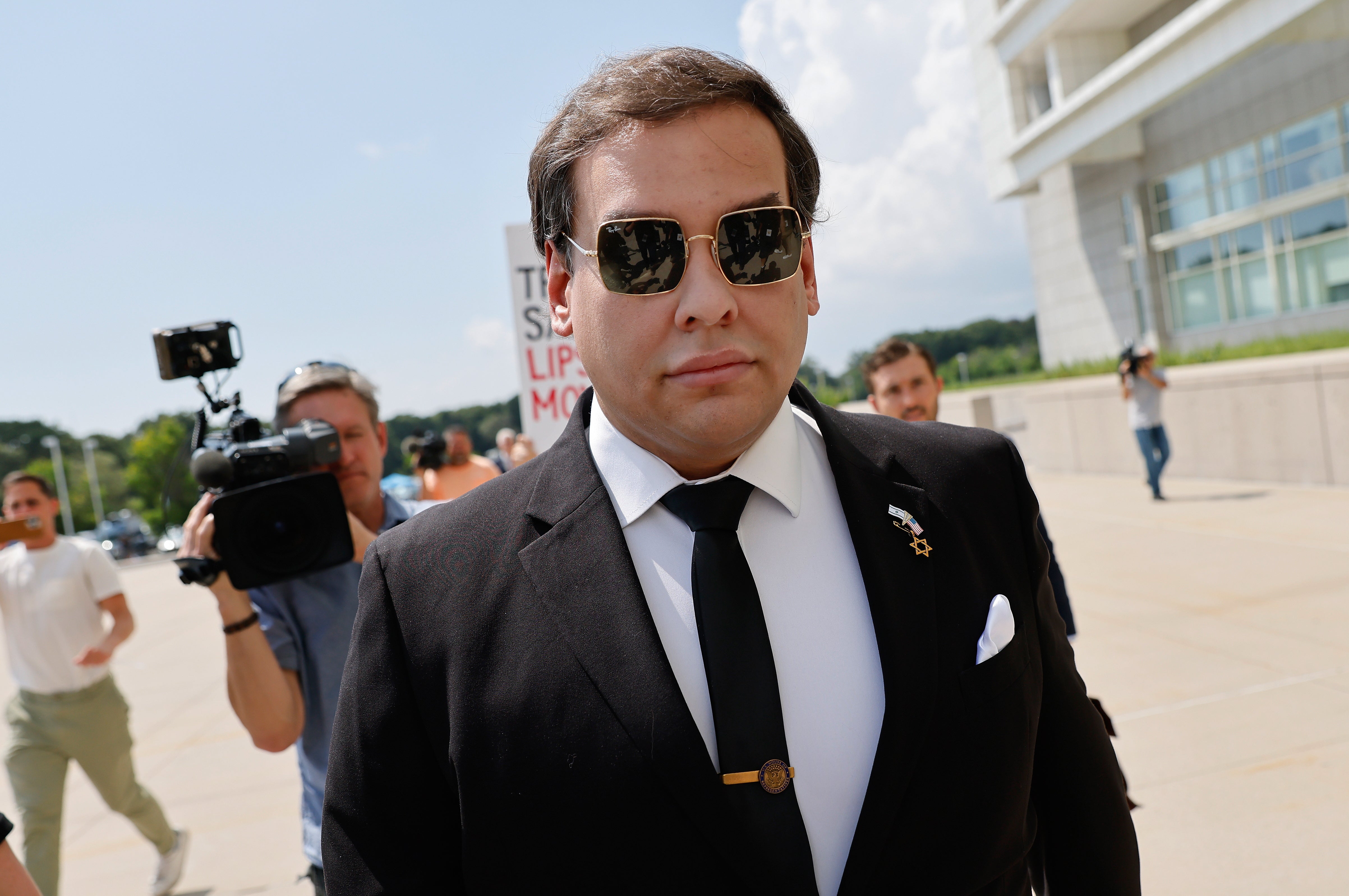 George Santos, walking into federal court in Central Islip, New York on August 19, pleaded guilty to aggravated identity theft and wire fraud charges