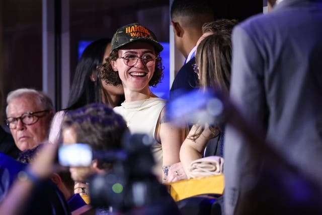 <p>Ella Emhoff appears at the Democratic National Convention on Monday night to support her stepmom Kamala Harris, wearing the now-popular ‘midwest princess’ camouflage hat</p>