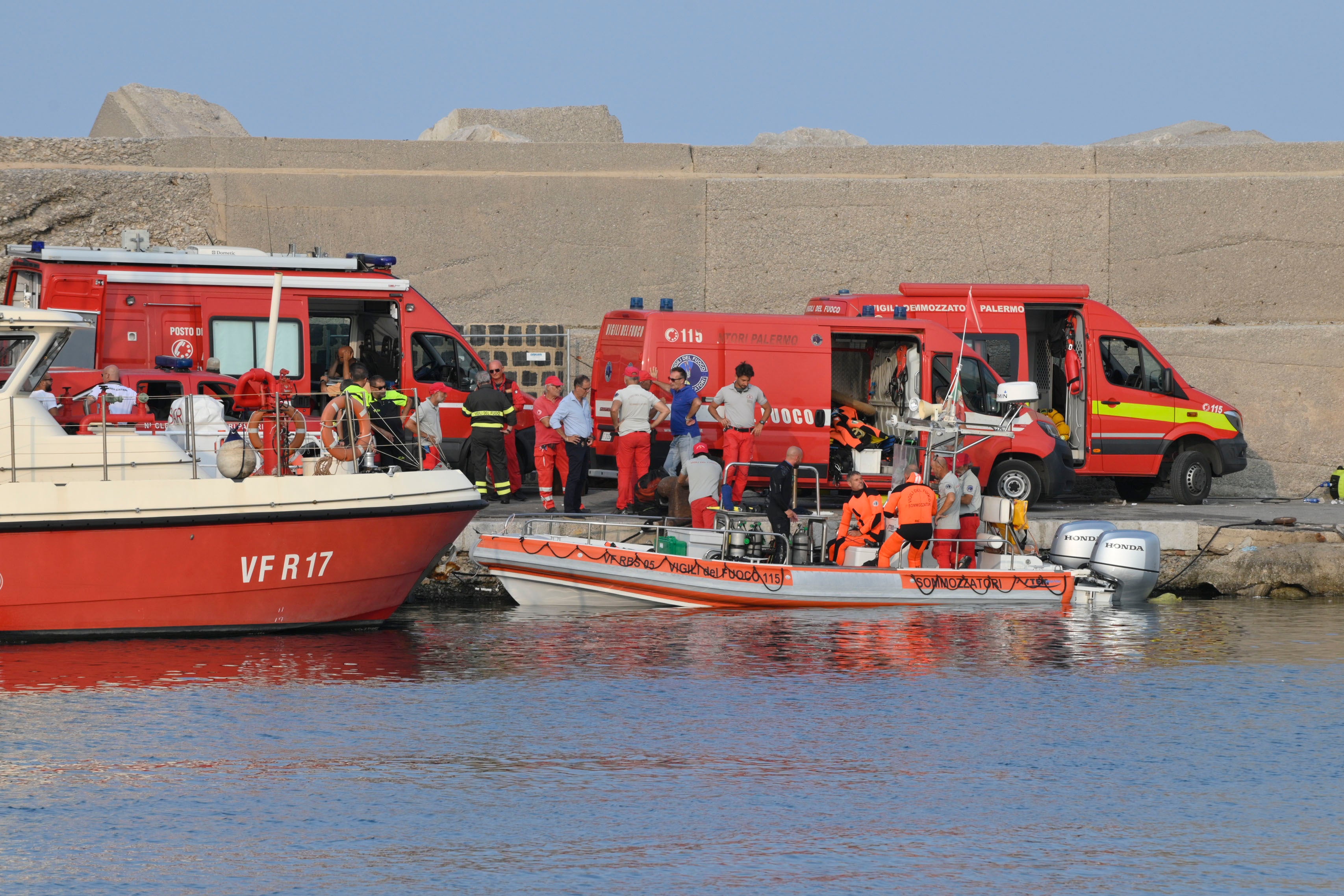 Italian scubadivers prepare to sail towards the yacht