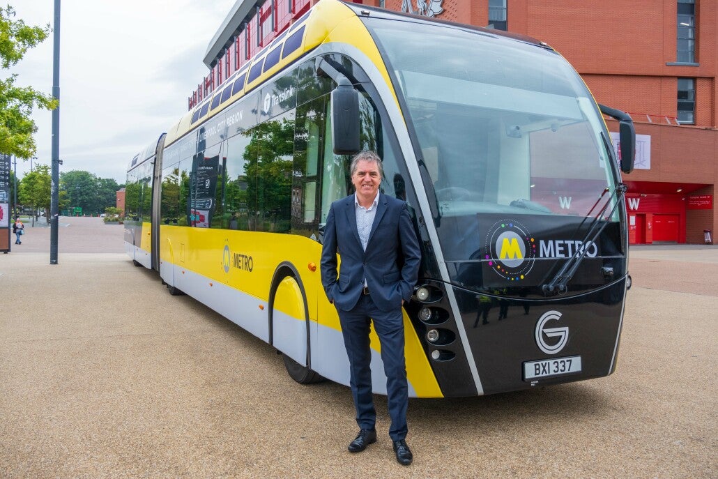 Liverpool Mayor Steve Rotheram stands next to the glider, which he hopes will be introduced in time for the Euros in 2028