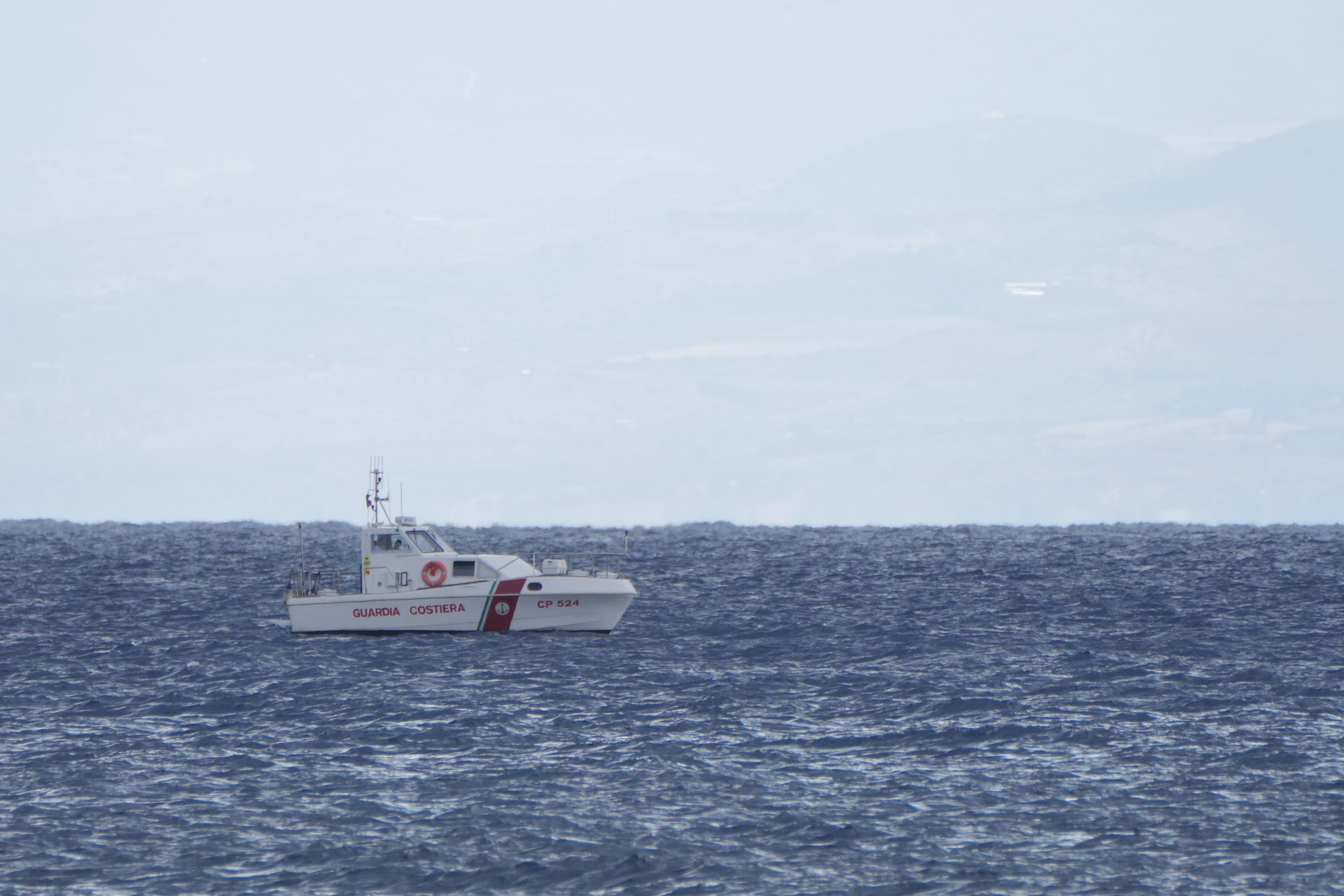 Italian emergency services heading towards the area off the Sicilian coast where a luxury yacht sank in a tornado (Jonathan Brady/PA)