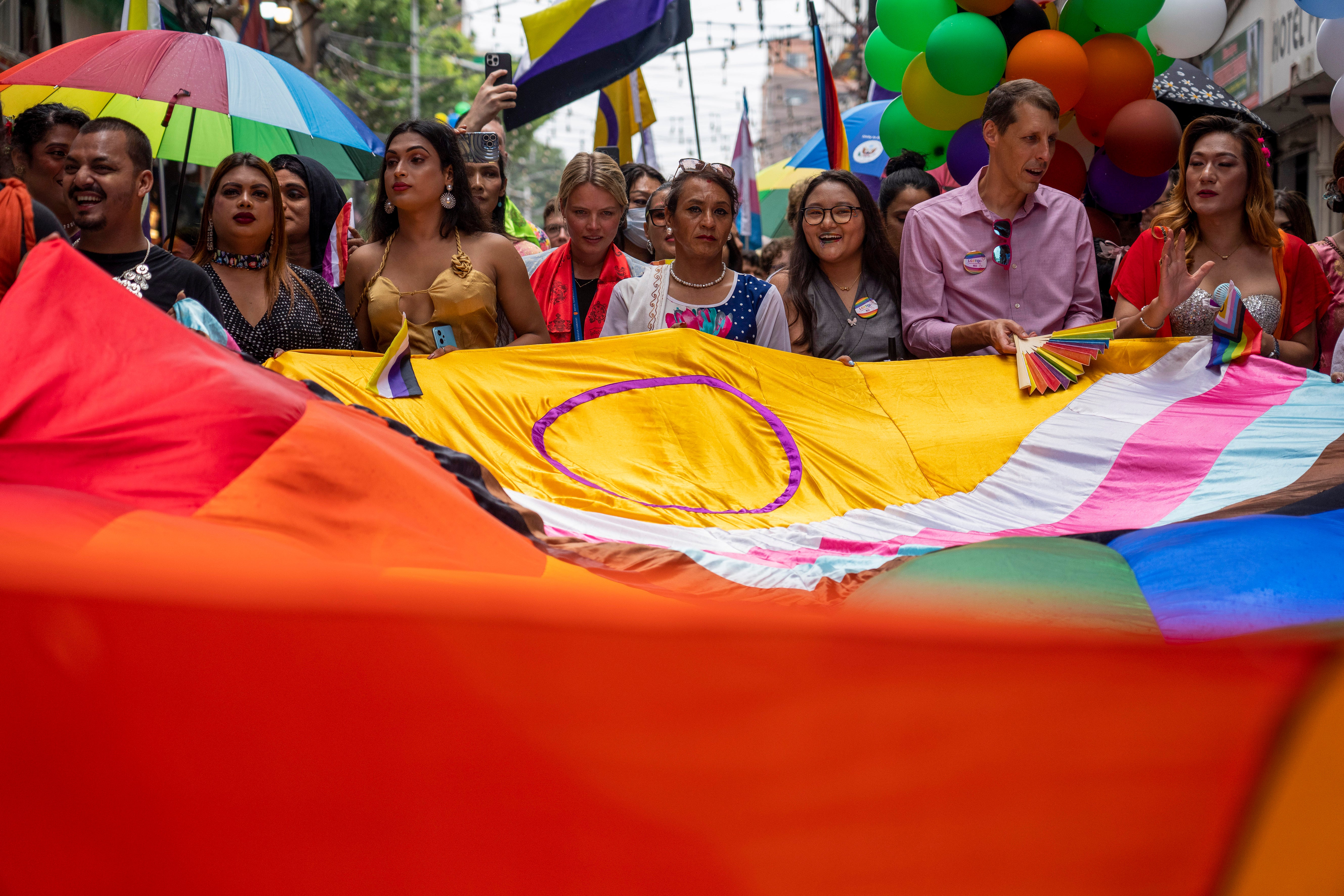 Samesex couples and LGBTQ+ activists rally in Nepal's capital during