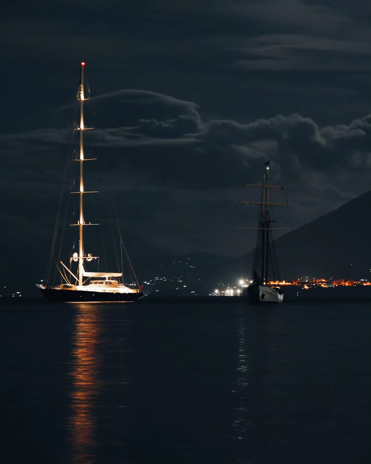 The yacht ‘Bayesian’ pictured in happier times with its 72-metre mast lit up