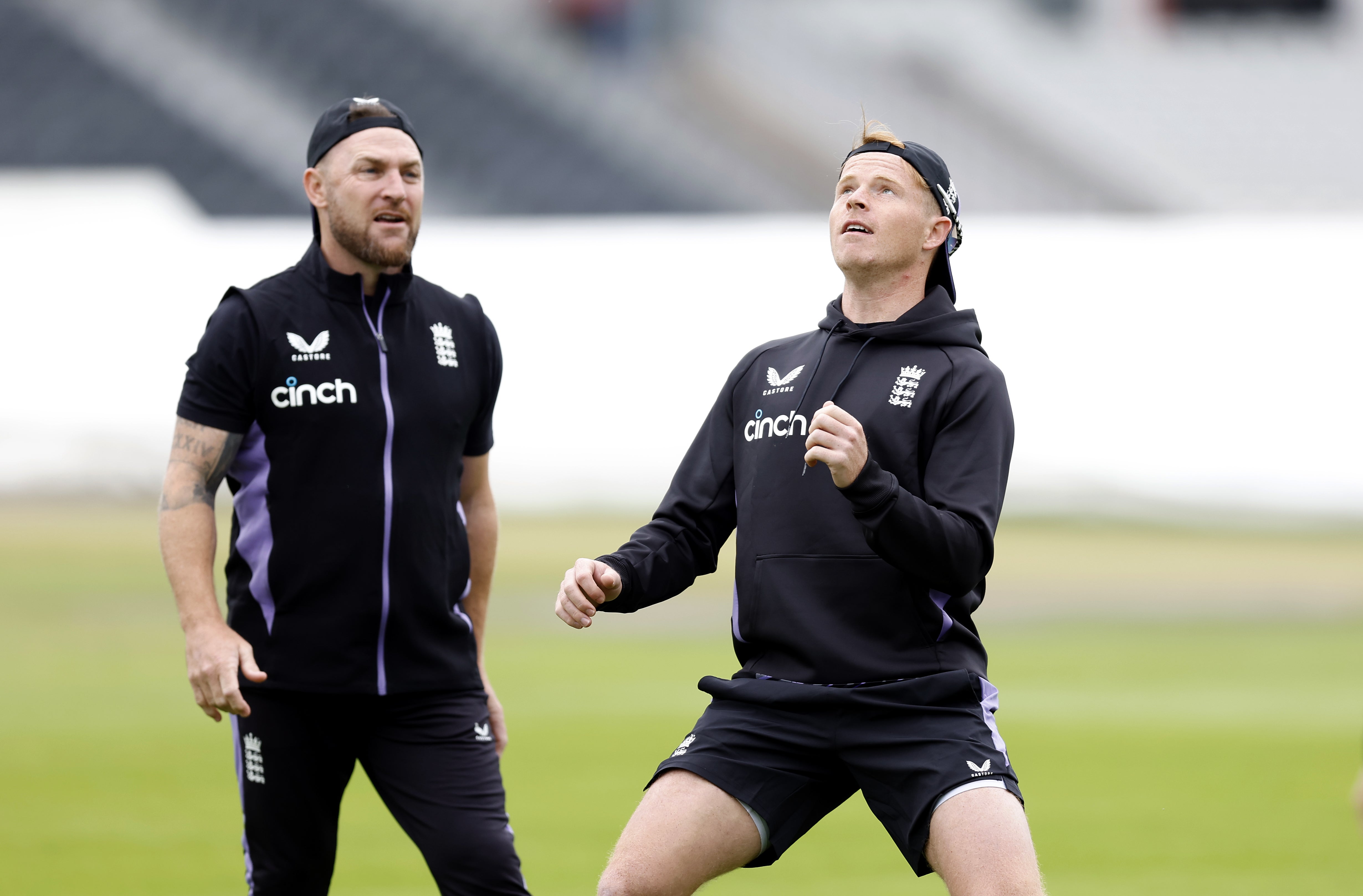 Ollie Pope alongside the England coach Brendon McCullum