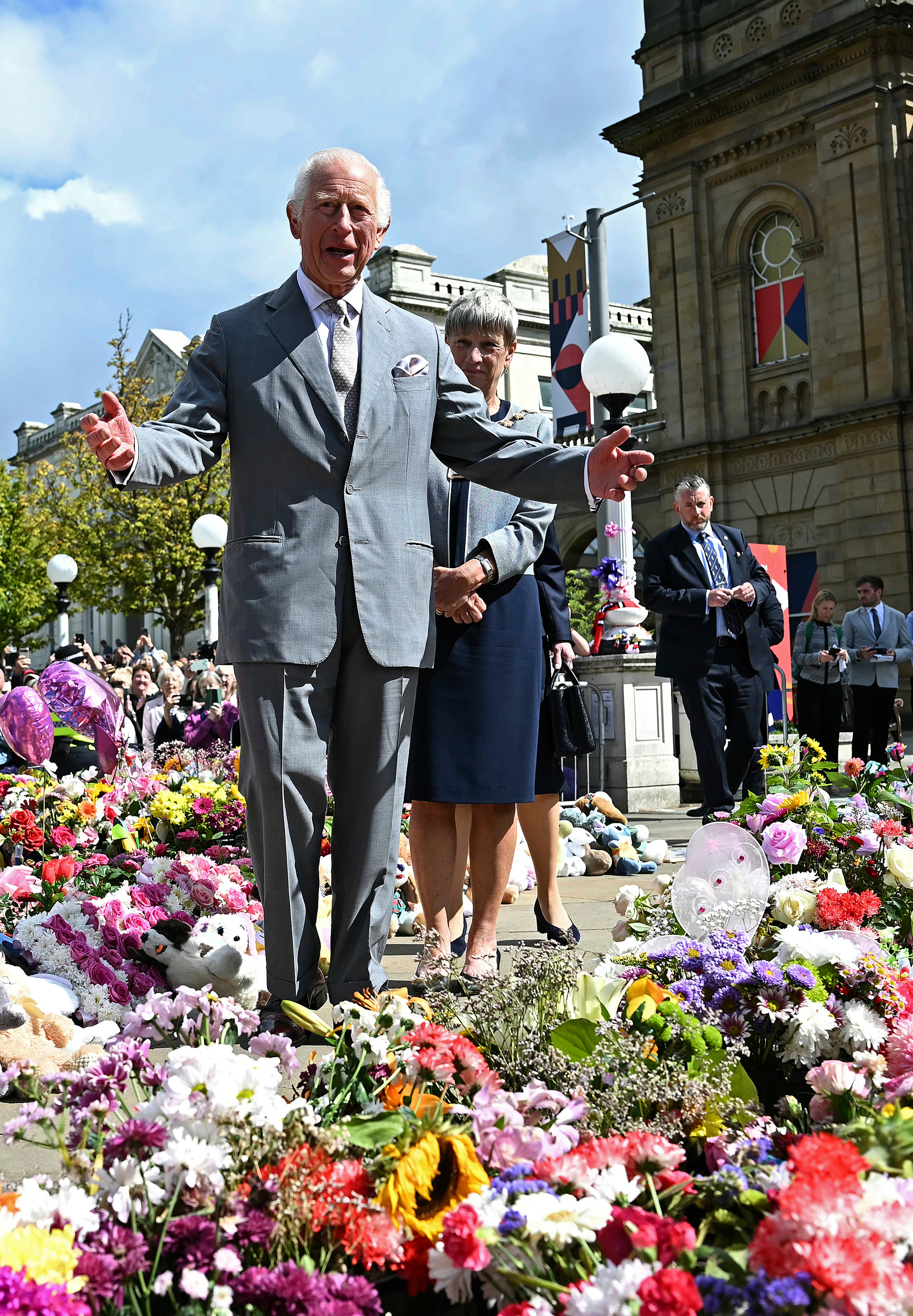 King Charles viewed the sea of floral tributes for the children who lost their lives in the horrific attack.