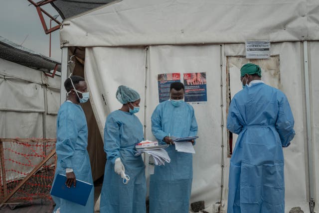 <p>Health workers walk between wards at the Mpox treatment centre at Nyiragongo General Referral Hospital, north of Goma </p>