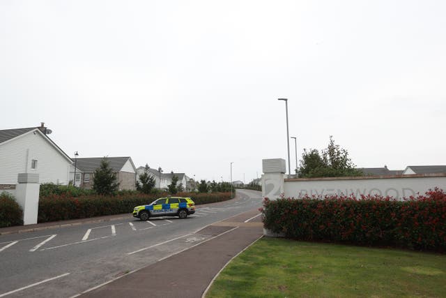 A police car outside the entrance to Rivenwood housing development in Newtownards, Co Down, where more than 400 homes have been evacuated due to an operation to clear what is suspected to be a Second World War-era bomb (Liam McBurney/PA)