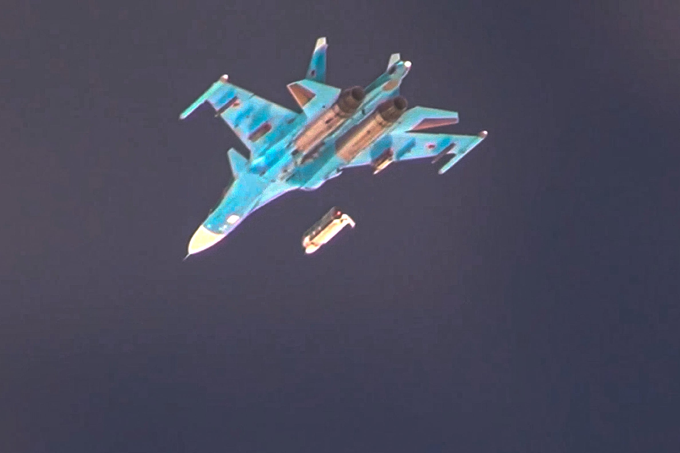 A Su-34 bomber belonging to the Russian air force drops a glide bomb on Ukraine’s Sumy region, in video released by the Russian defence ministry