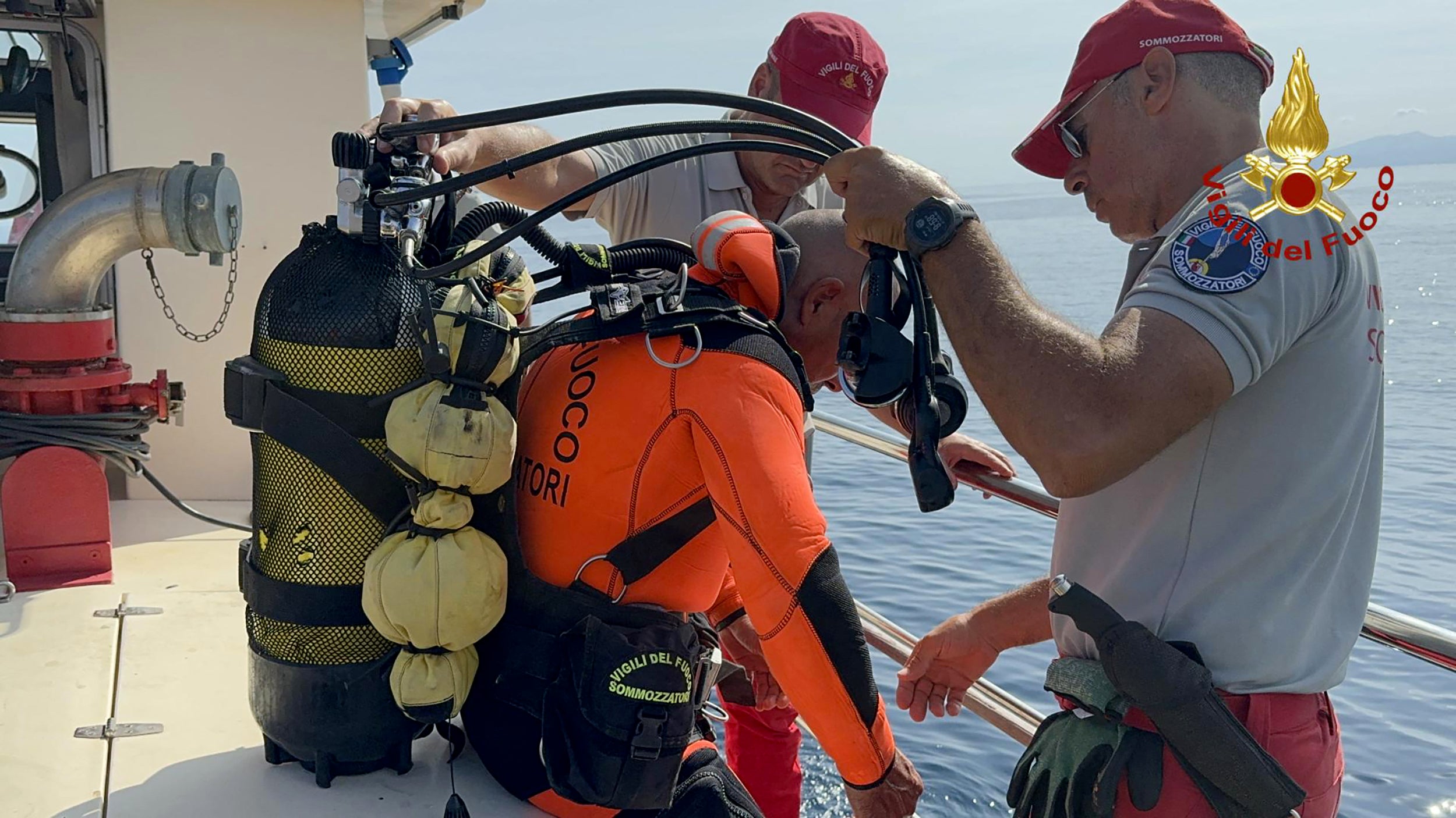 Divers prepare to enter the treacherous wreck