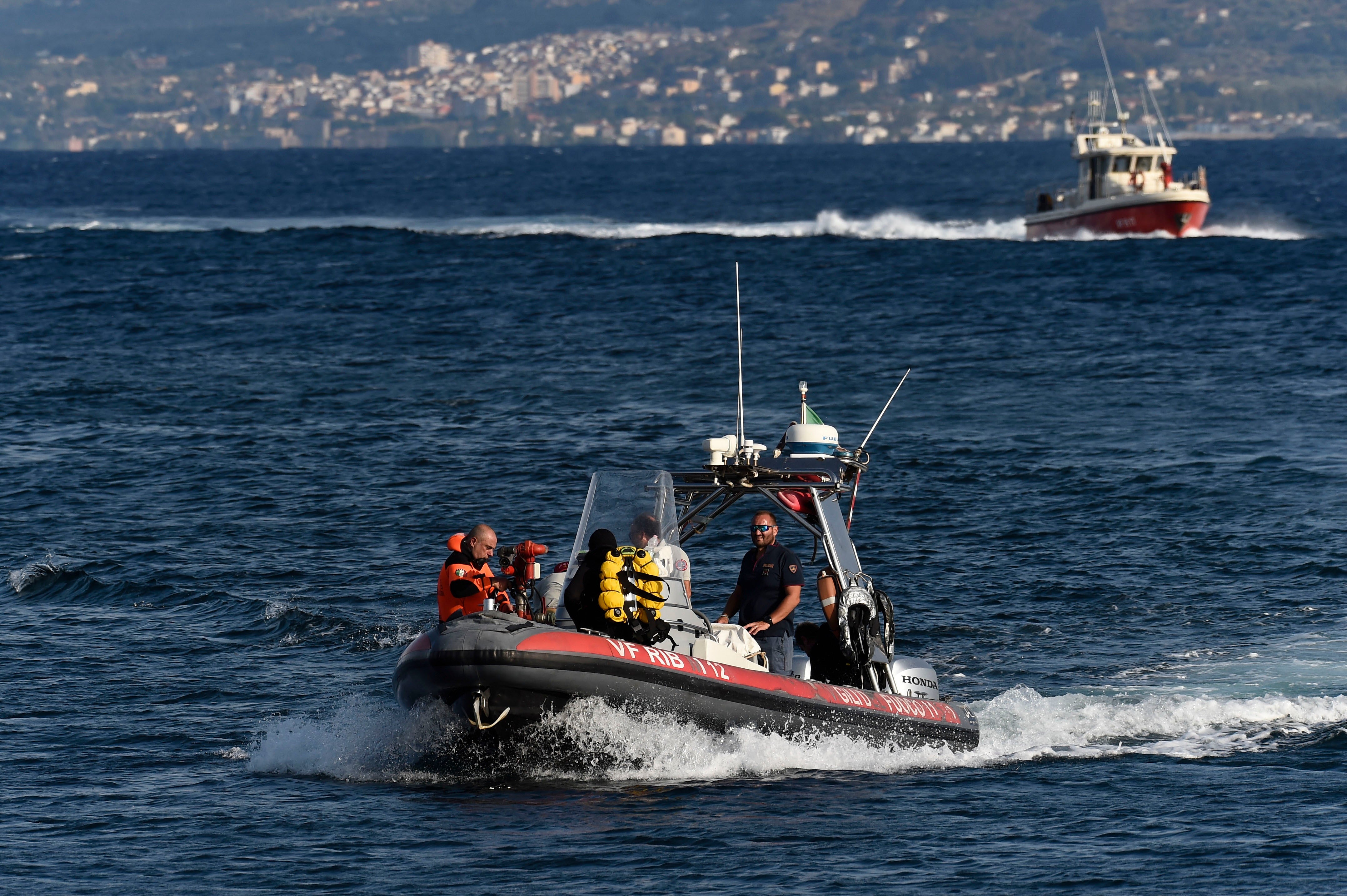 Emergency services search for a missing boat in Porticello, southern Italy