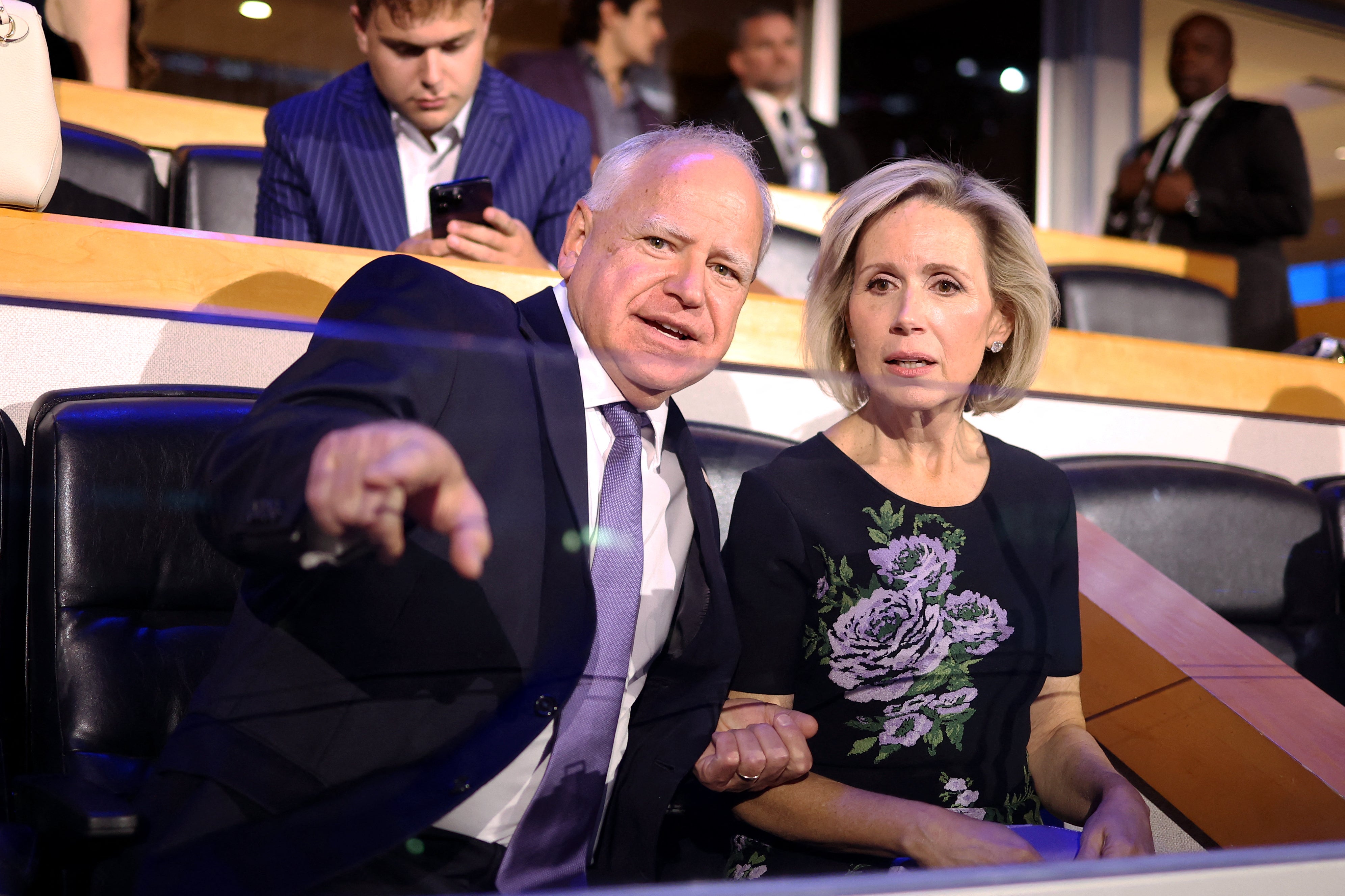 Tim Walz and his wife Gwen Walz attend the first day of the Democratic National Convention in Chicago on August 19.