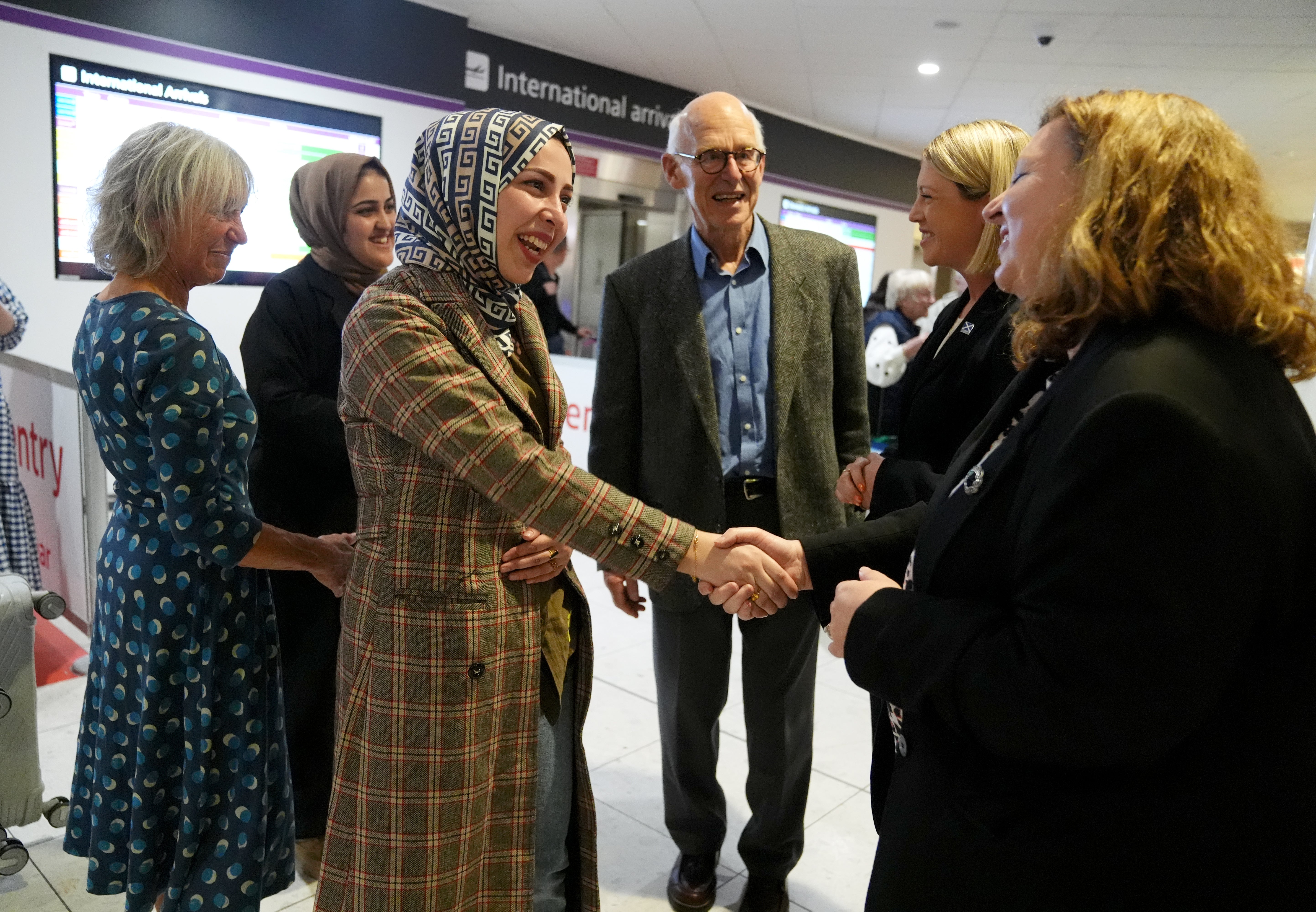 Scotland Office minister Kirsty McNeill and Scottish Education Secretary Jenny Gulruth were at the ariport to greet the women, along with John and Lorna Norgrove. (Andrew Milligan/PA)