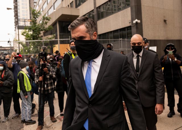 <p>Former Minneapolis Police officers Thomas Lane (C) and J. Alexander Keung (R) leave the Hennepin County Family Justice Center after a pre trial hearing on September 11, 2020 in Minneapolis, Minnesota</p>