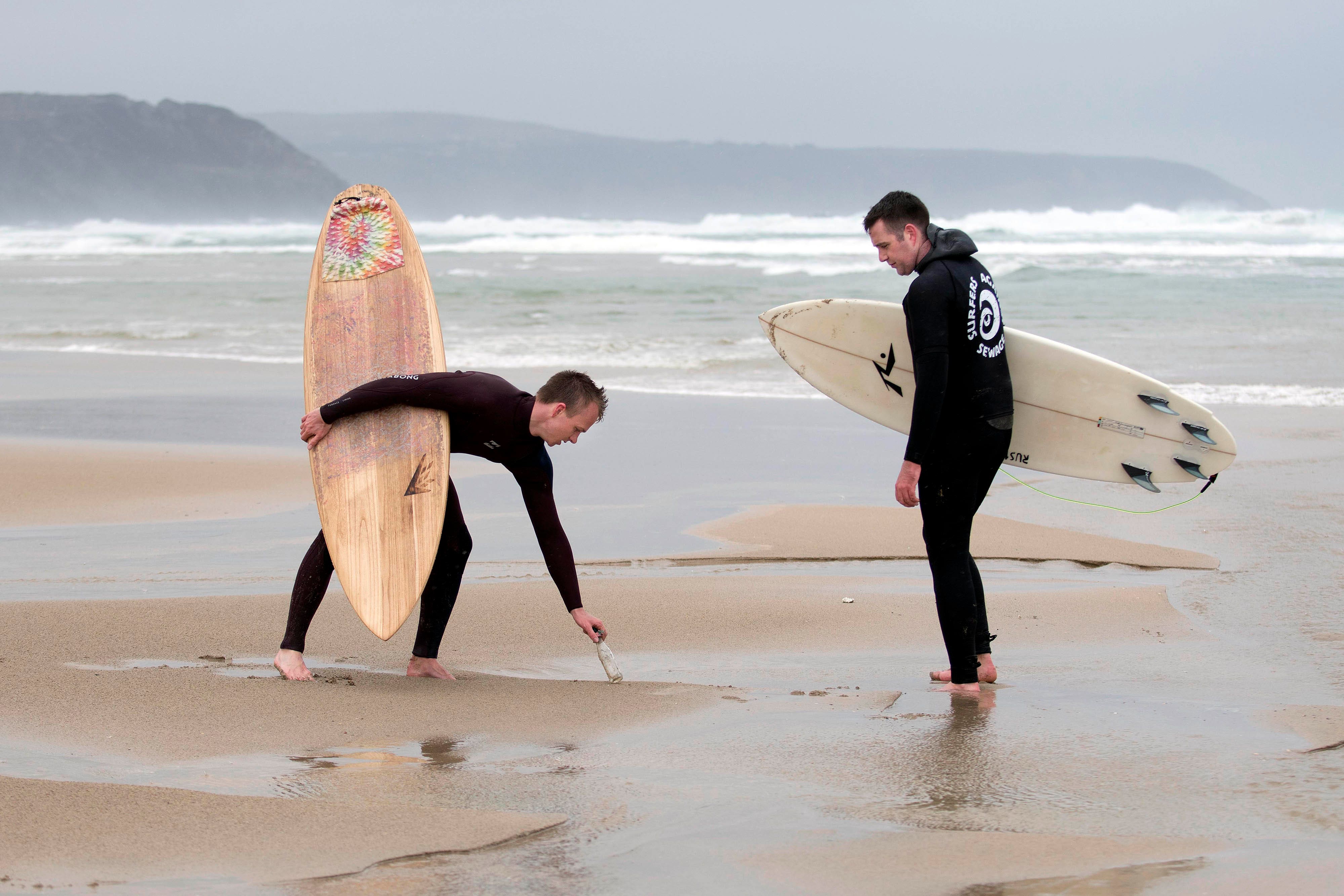 Campaigners from UK marine conservation charity Surfers Against Sewage in Perranporth, Cornwall (Emily Whitfield-Wicks/PA)