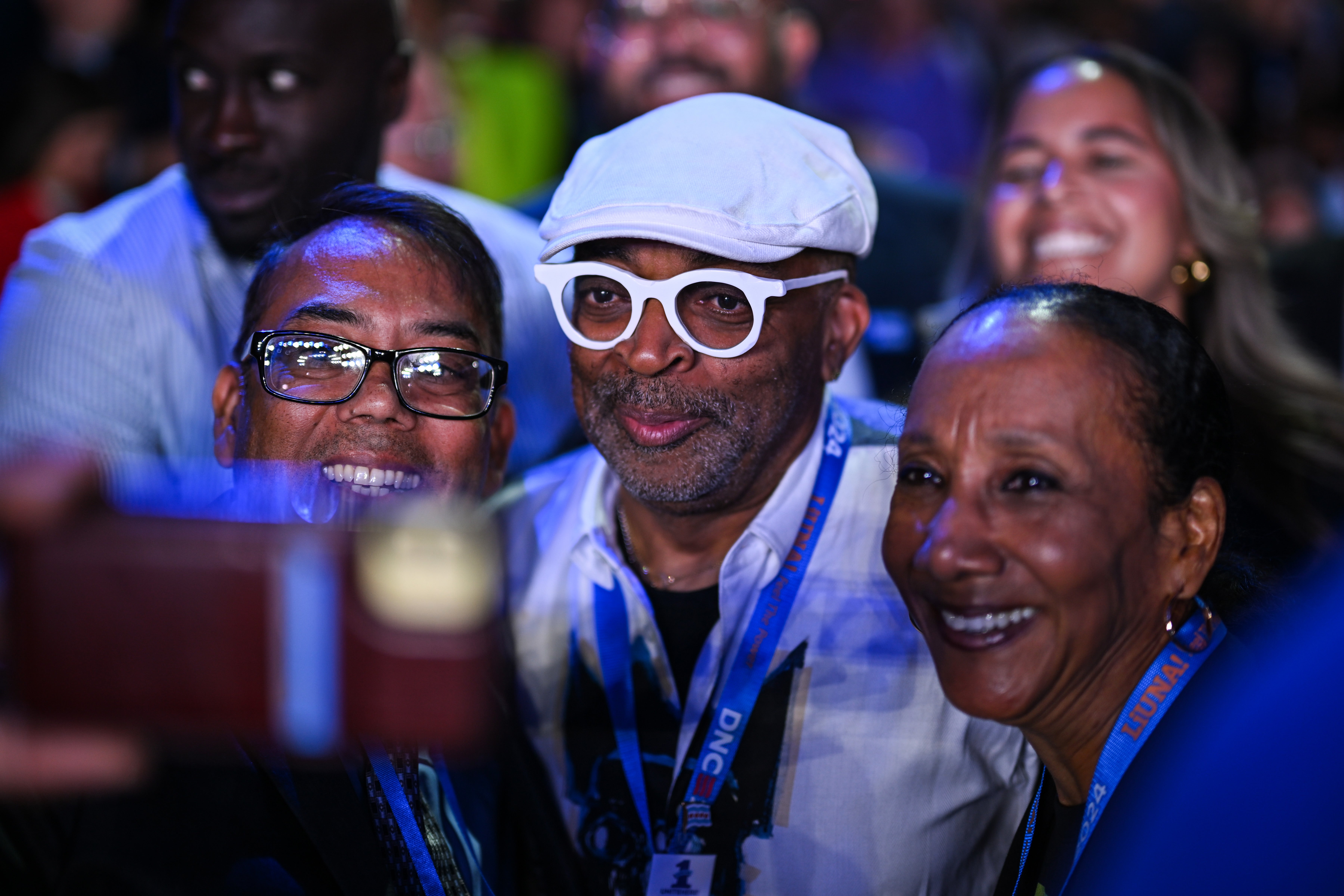 Legendary director and producer Spike Lee poses for a selfie during the second day of the Democratic National Convention at the United Center in Chicago on Tuesday