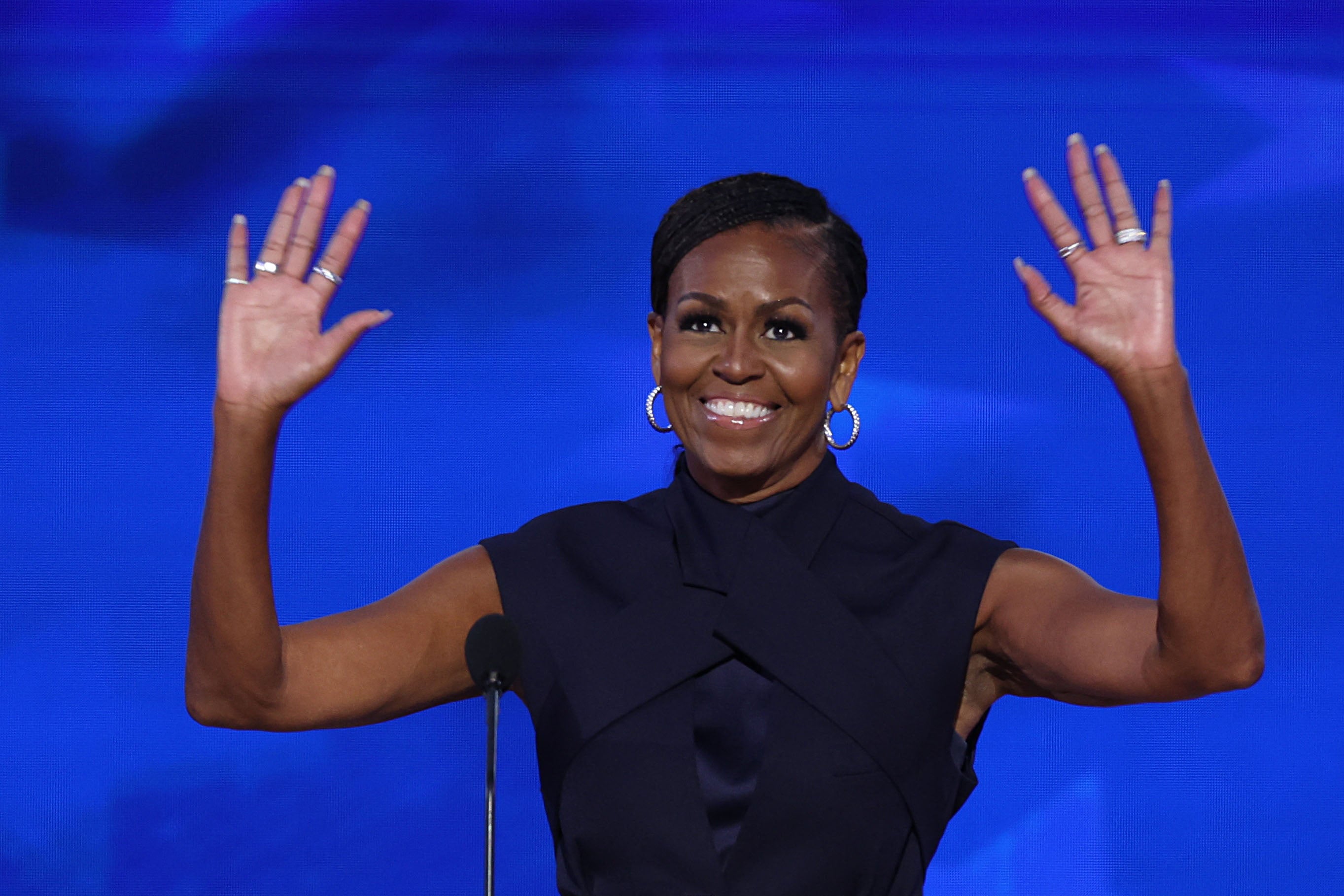 Michelle Obama means business in navy power suit as she calls on ...