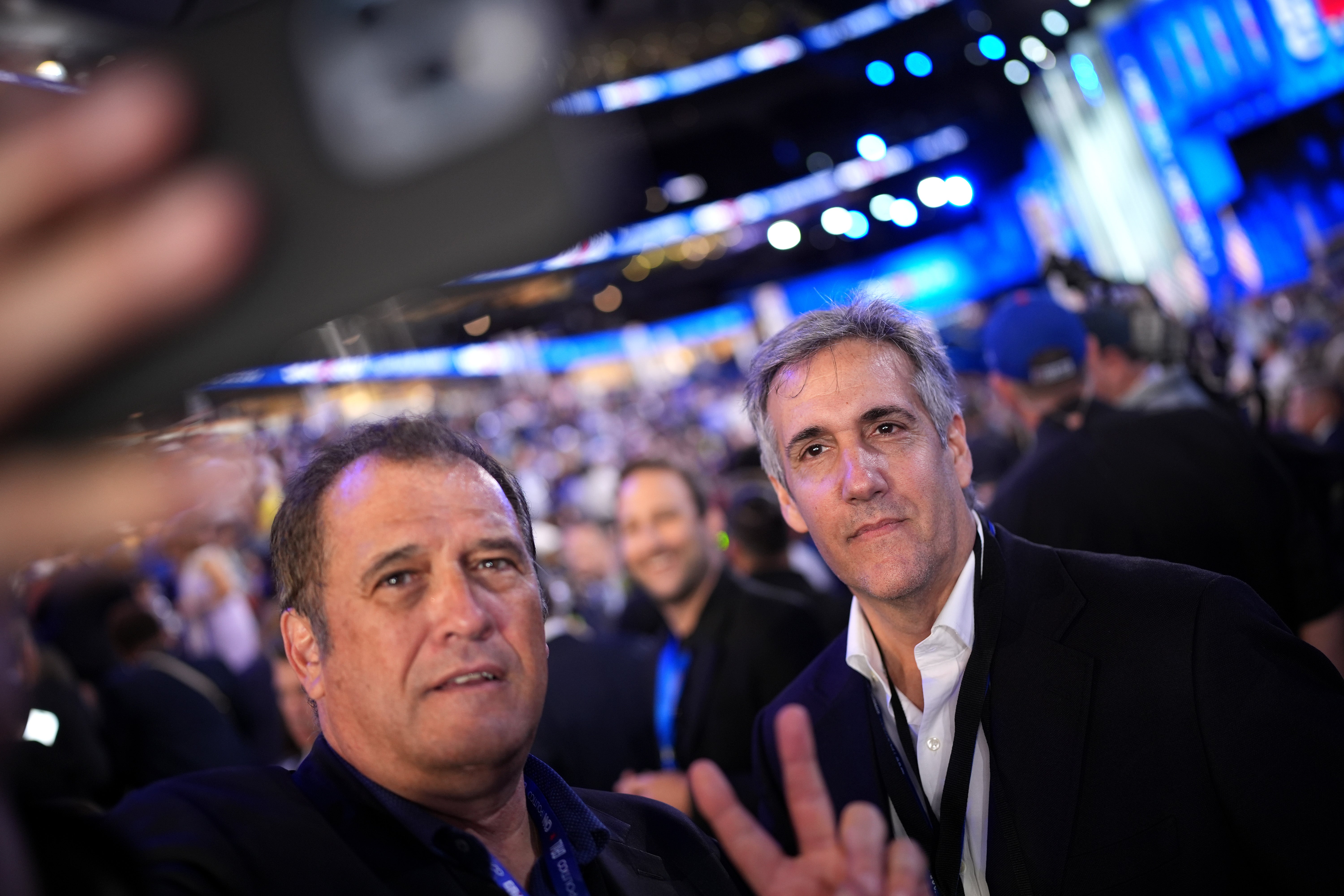 Journalist Brian Karem poses for a selfie with Michael Cohen, former personal lawyer of former U.S. President Donald Trump, on the second day of the Democratic National Convention at the United Center on August 20, 2024 in Chicago, Illinois. The former fixer was not the only former Trump ally to attend the DNC