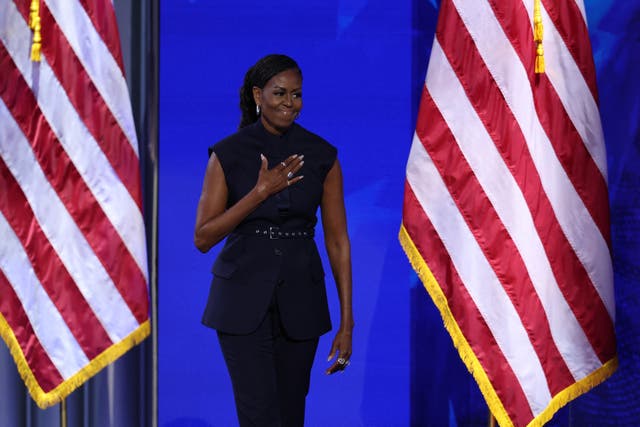 <p>Michelle Obama takes the stage during Day two of the Democratic National Convention in Chicago on August 20</p>