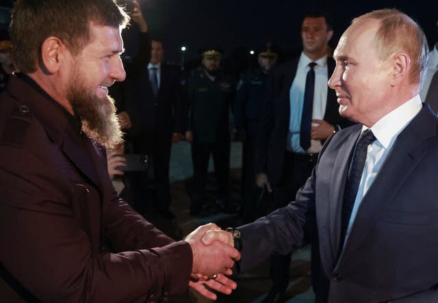 <p>Russian President Vladimir Putin, right, is welcomed by Head of Russian Chechen Republic Ramzan Kadyrov</p>