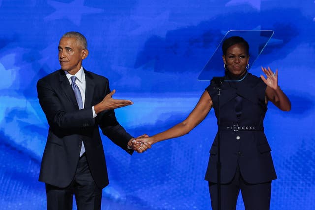 <p>Barack and Michelle Obama on stage together at the Democratic National Convention in Chicago </p>