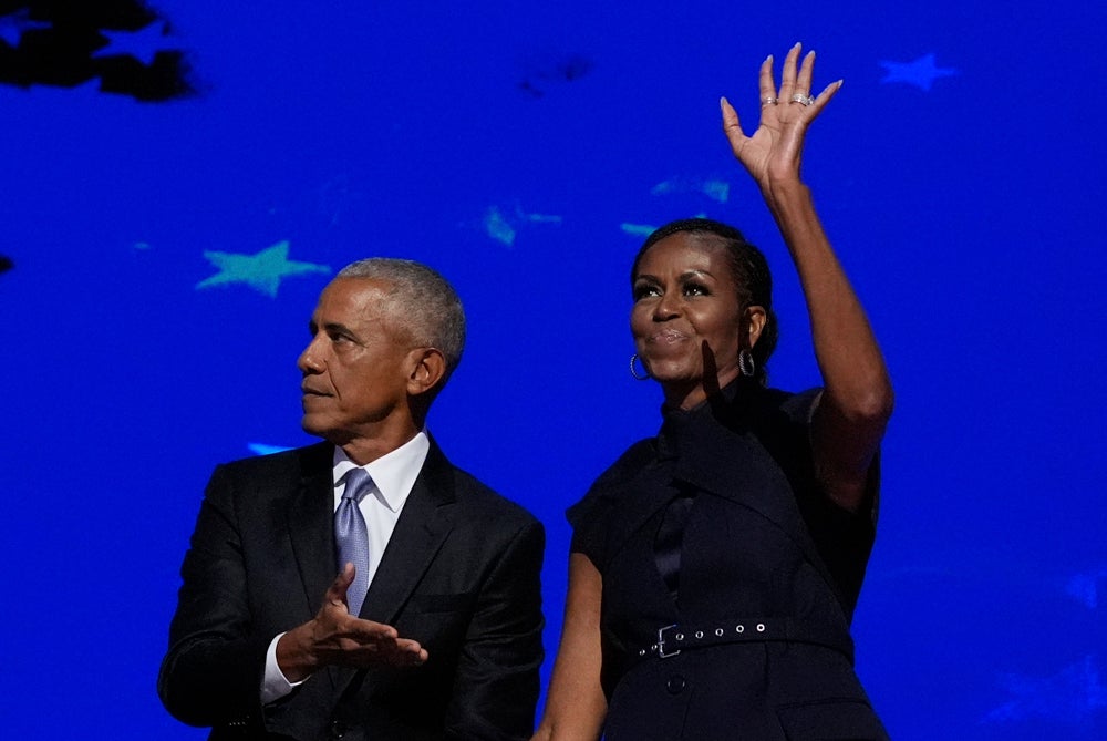 Michelle Obama and Barack Obama received a warm welcome at the DNC on Tuesday