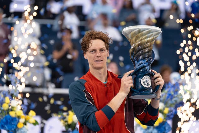 <p>Jannik Sinner poses with the Cincinnati Open trophy</p>