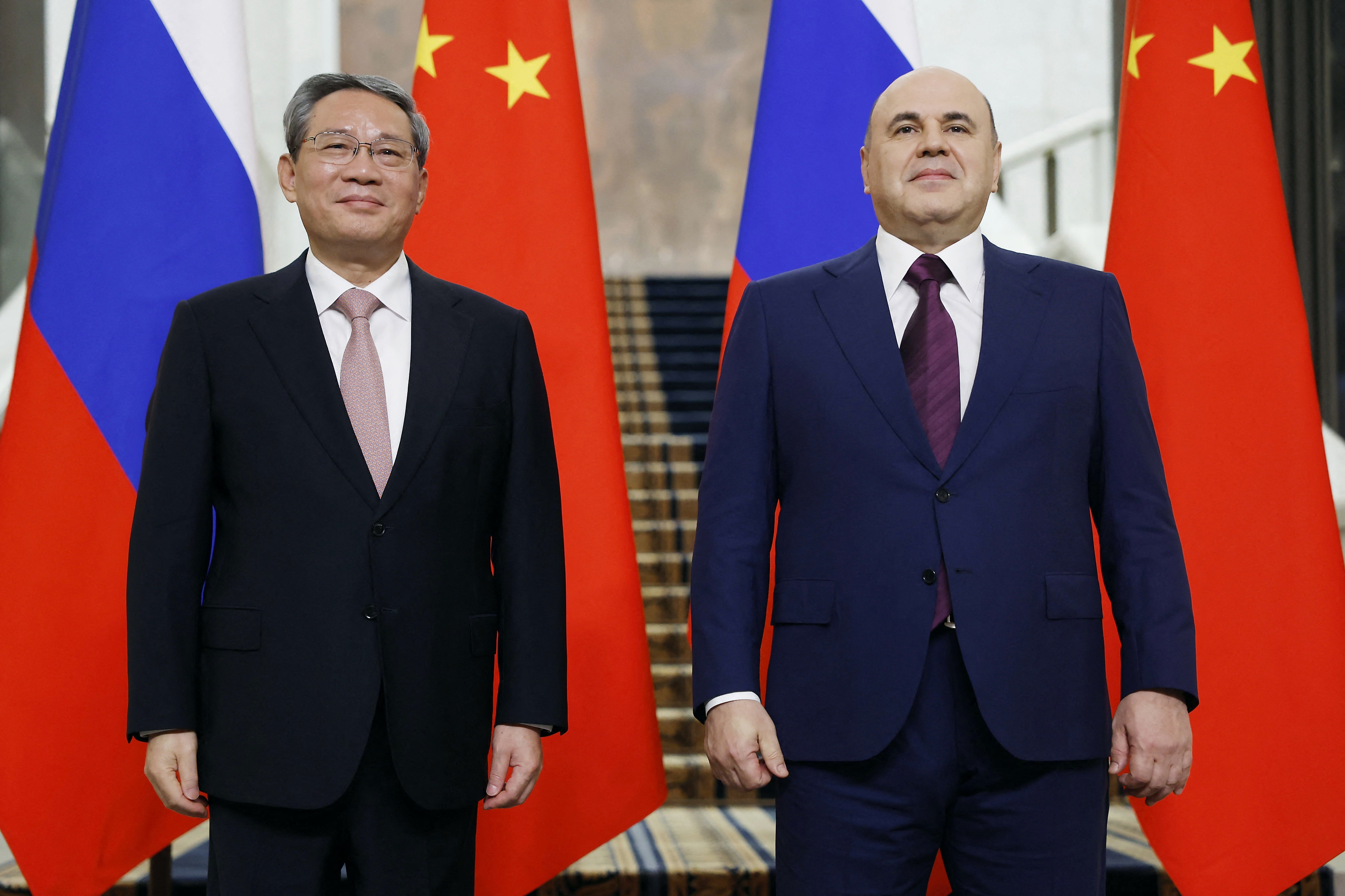 Russia's prime minister Mikhail Mishustin poses with Premier of the State Council of China Li Qiang